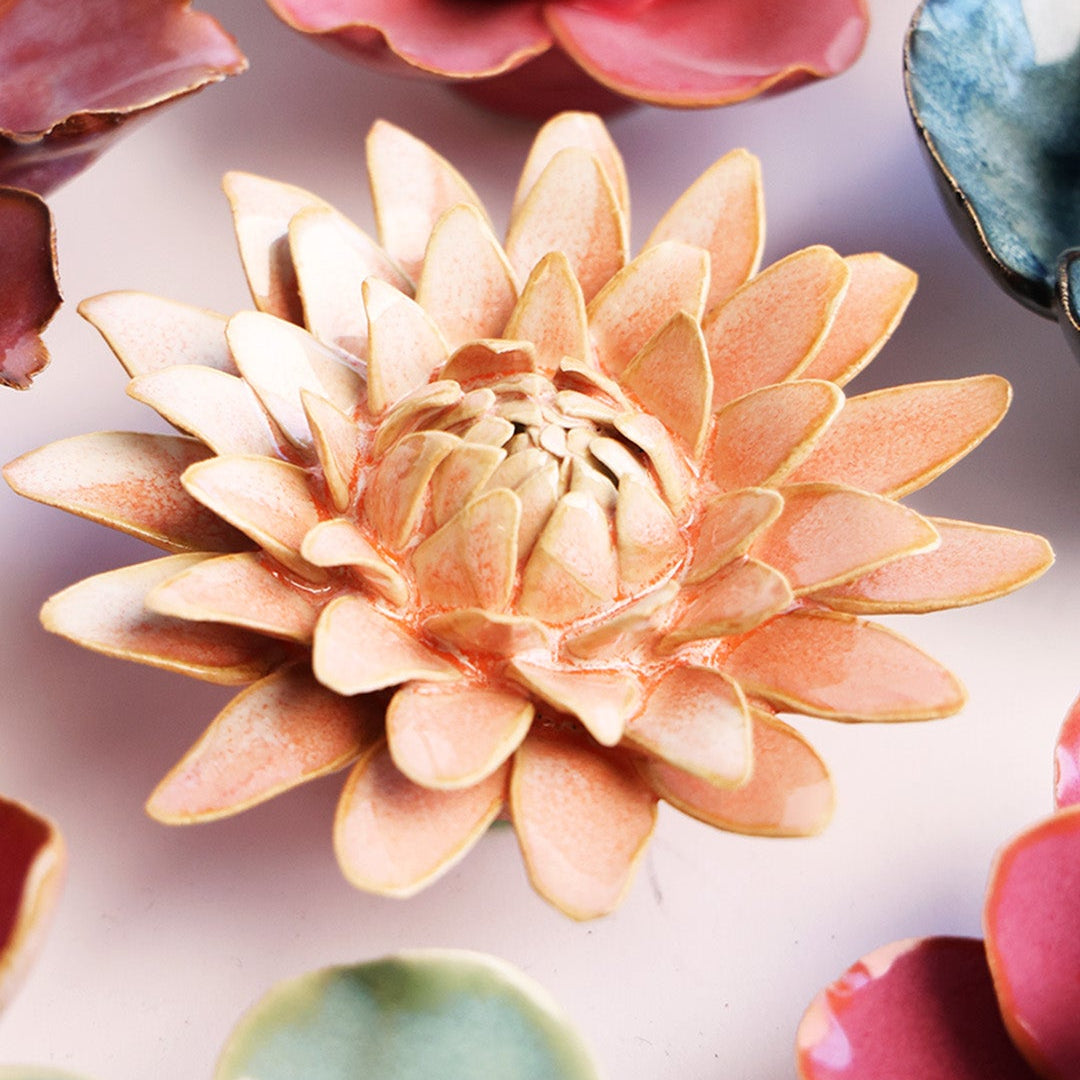 Peach Pink Strawflower ceramic wall flower styled on a white table with other flowers — Chive Studio