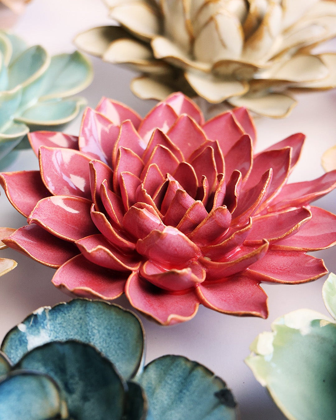 Blush Pink Madonna Azalea ceramic wall flower mounted on a wall — Chive Ceramics Studio