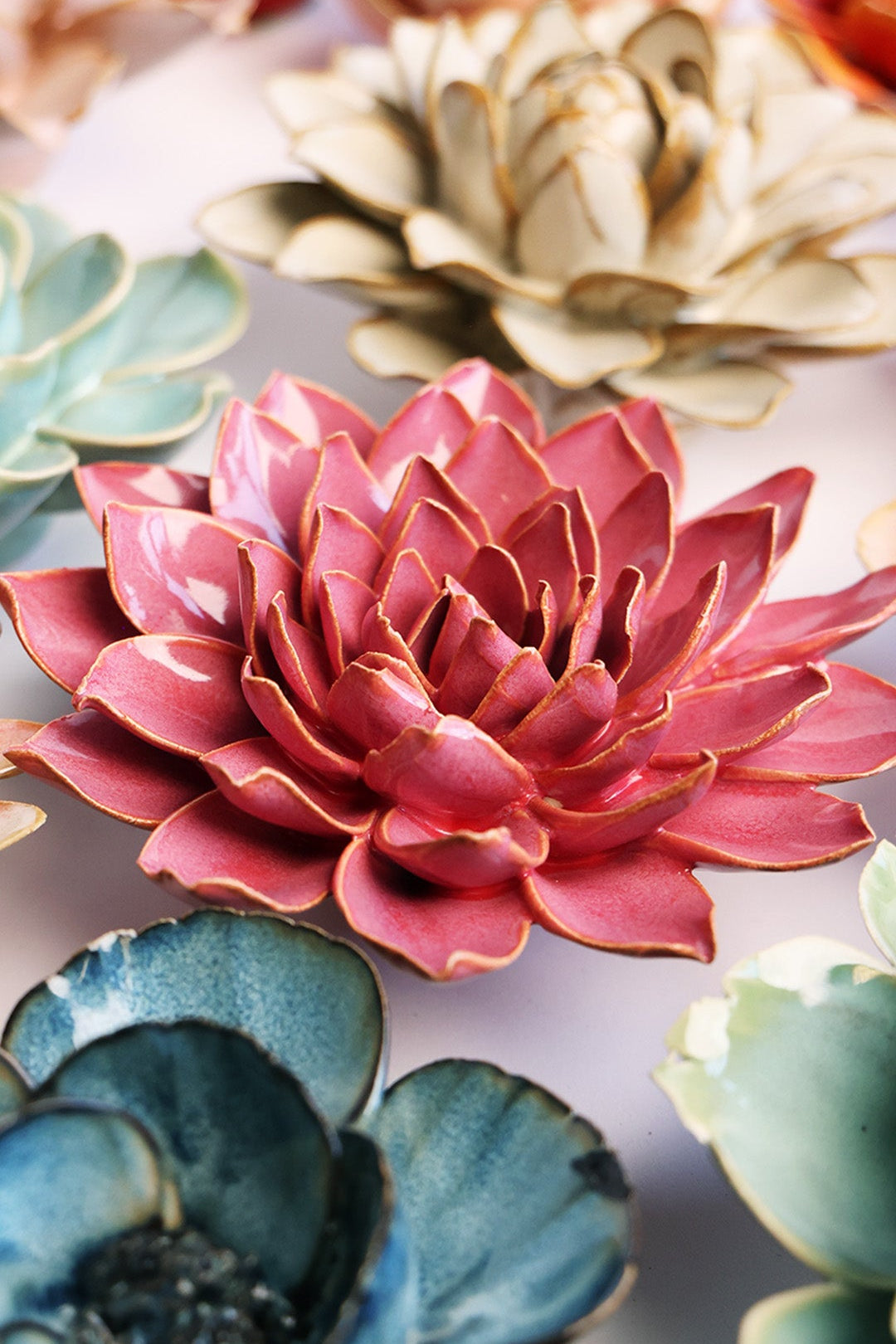 Blush Pink Azalea ceramic wall flower styled on a white table with other flowers — Chive Studio