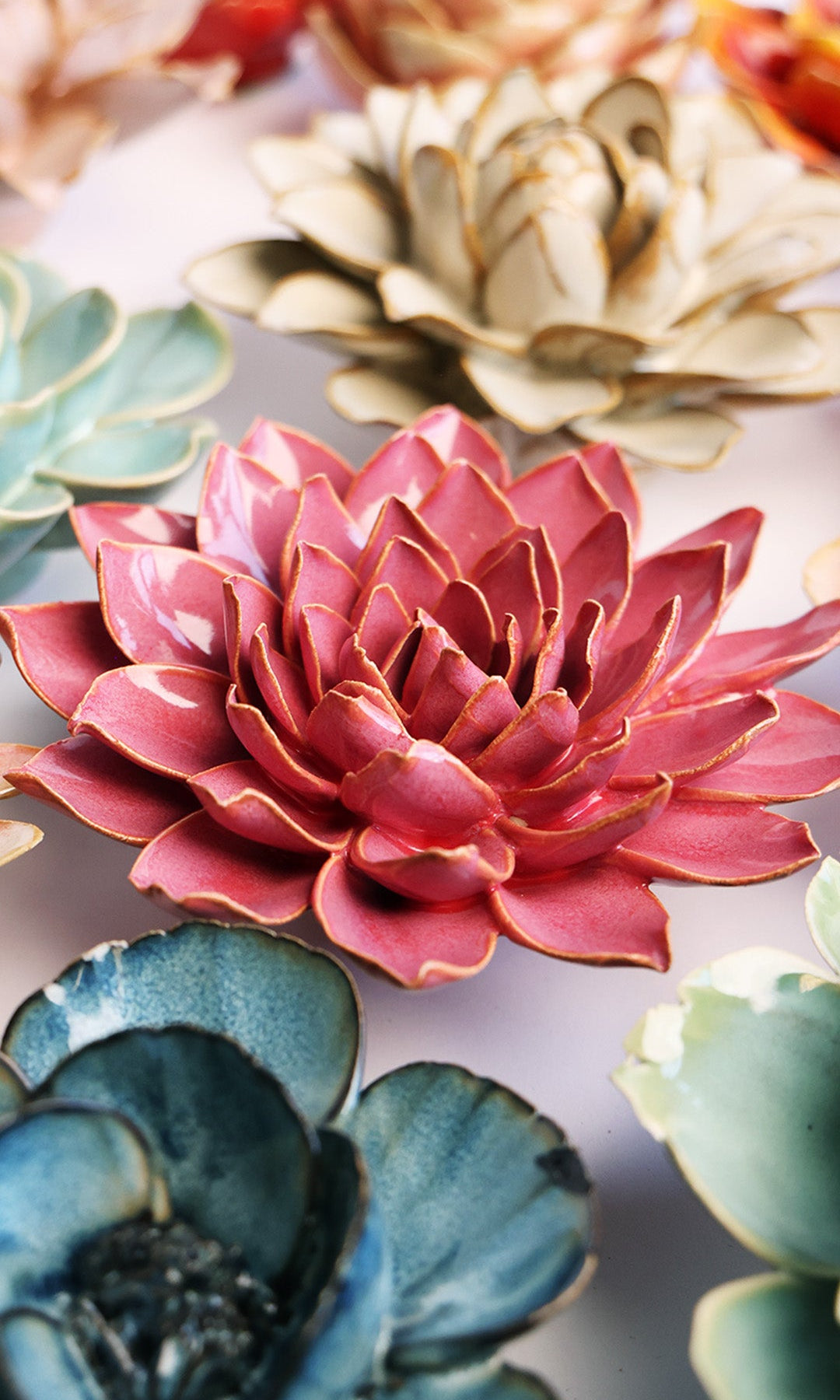 Blush Pink Azalea ceramic wall flower styled on a white table with other flowers — Chive Studio