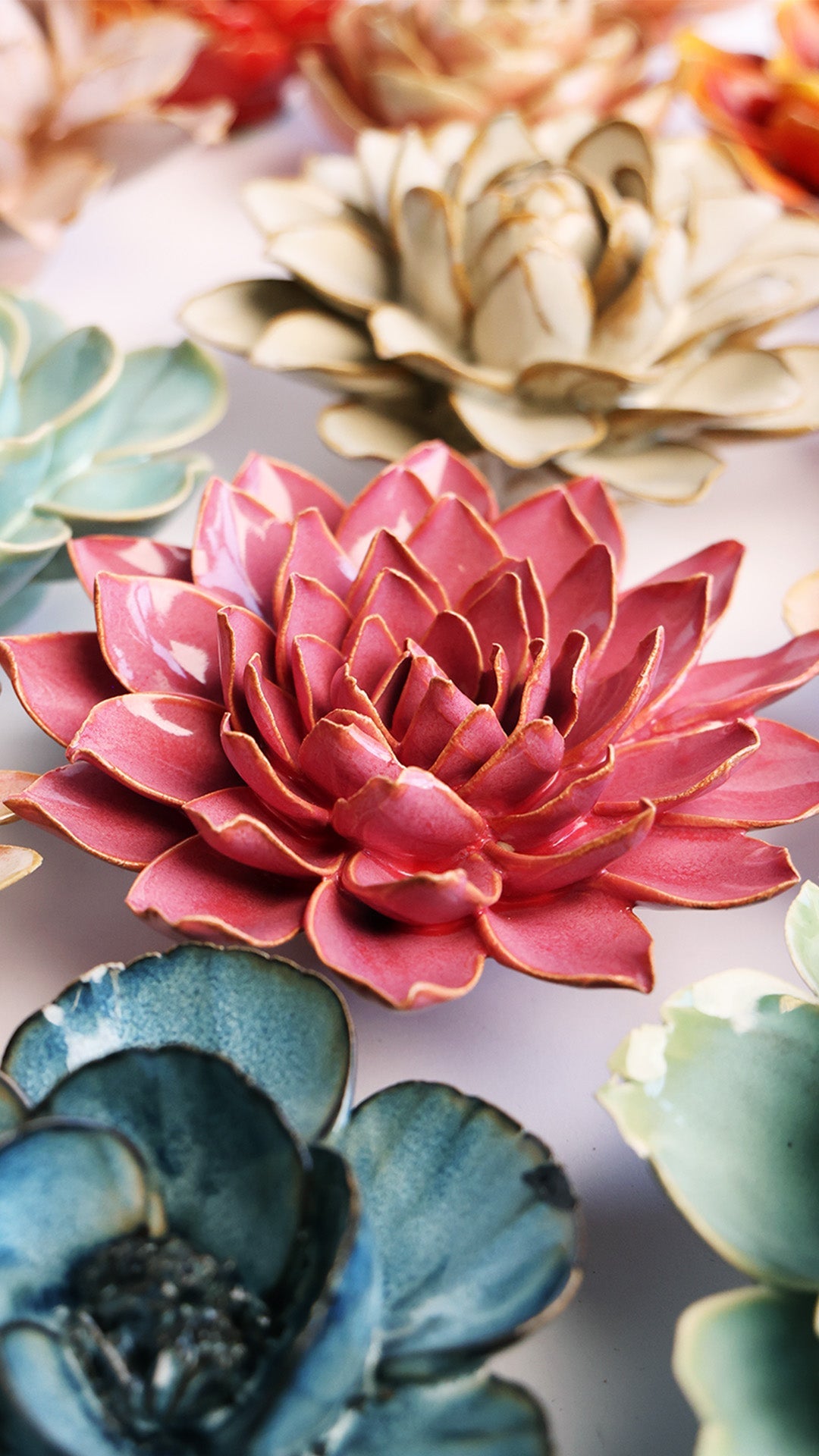 Blush Pink Azalea ceramic wall flower styled on a white table with other flowers — Chive Studio