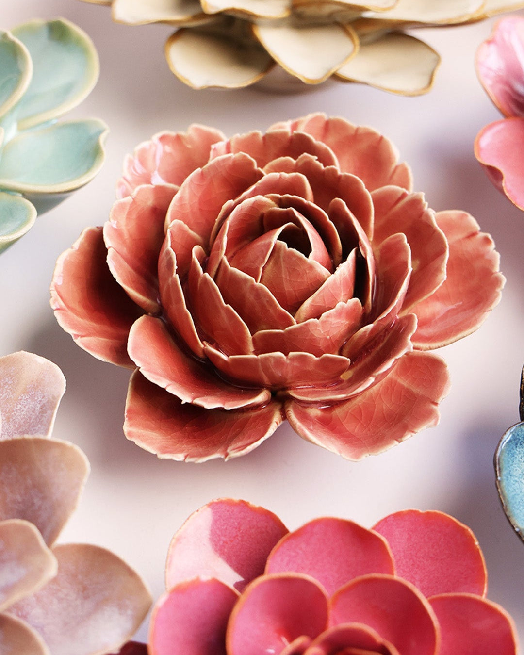 Champagne Pink Rose ceramic wall flower styled on a white table with other flowers — Chive Studio
