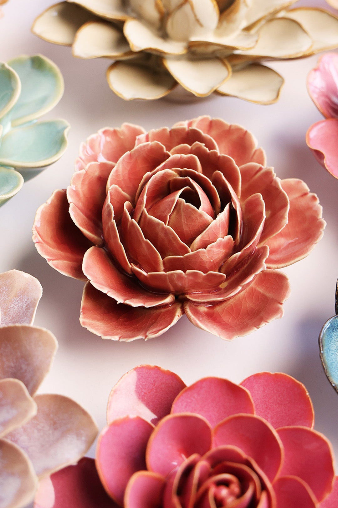 Champagne Pink Rose ceramic wall flower styled on a white table with other flowers — Chive Studio