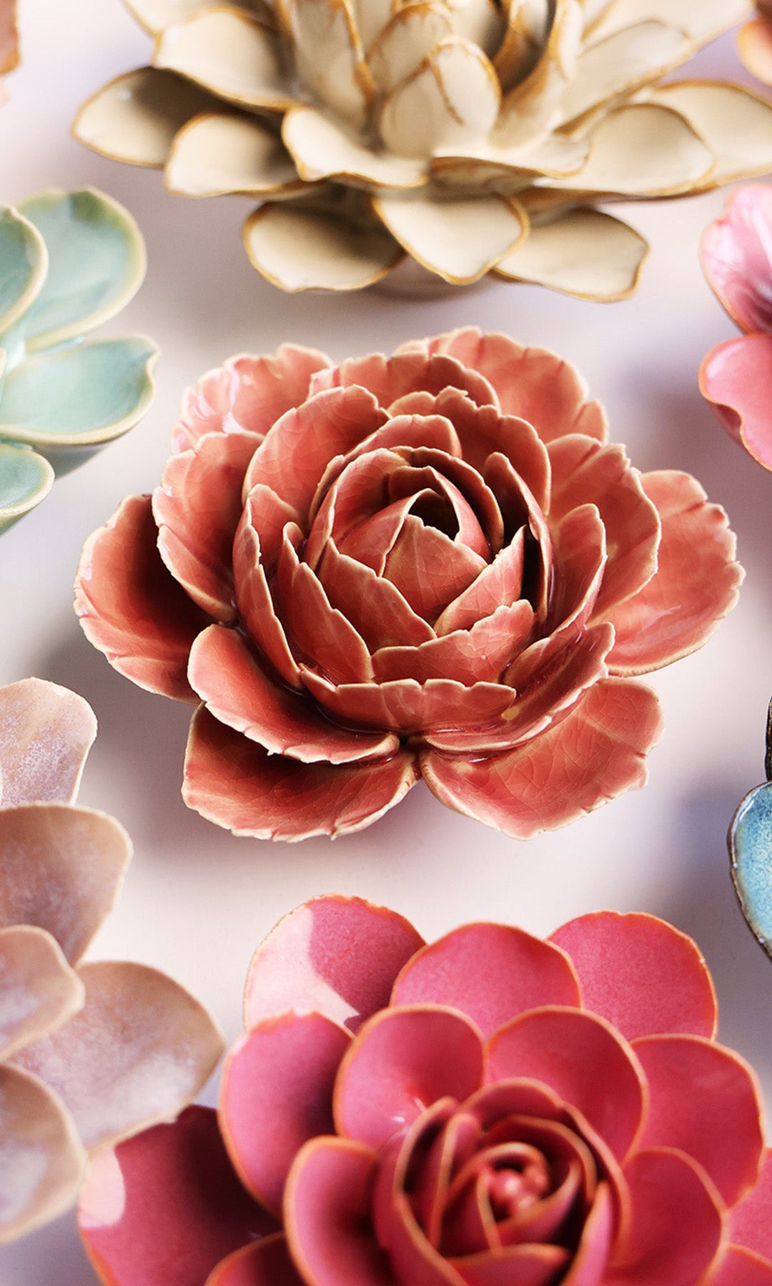 Champagne Pink Rose ceramic wall flower styled on a white table with other flowers — Chive Studio