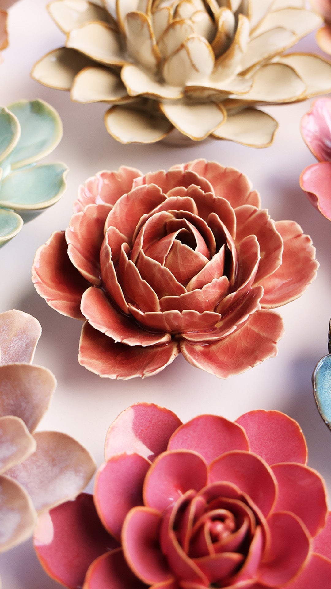 Champagne Pink Rose ceramic wall flower styled on a white table with other flowers — Chive Studio