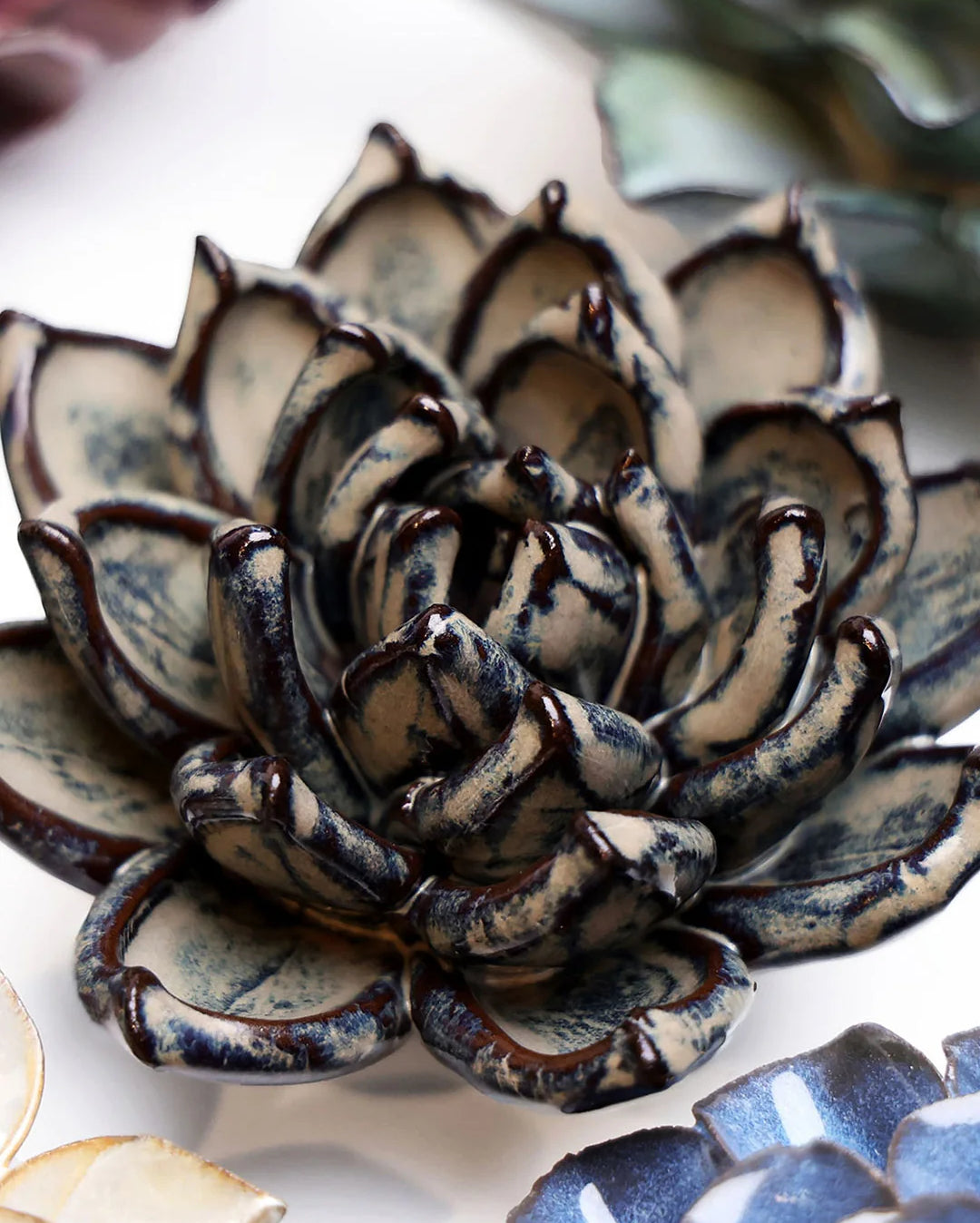 Latte Echeveria ceramic wall flower styled on a white table with other flowers — Chive Studio