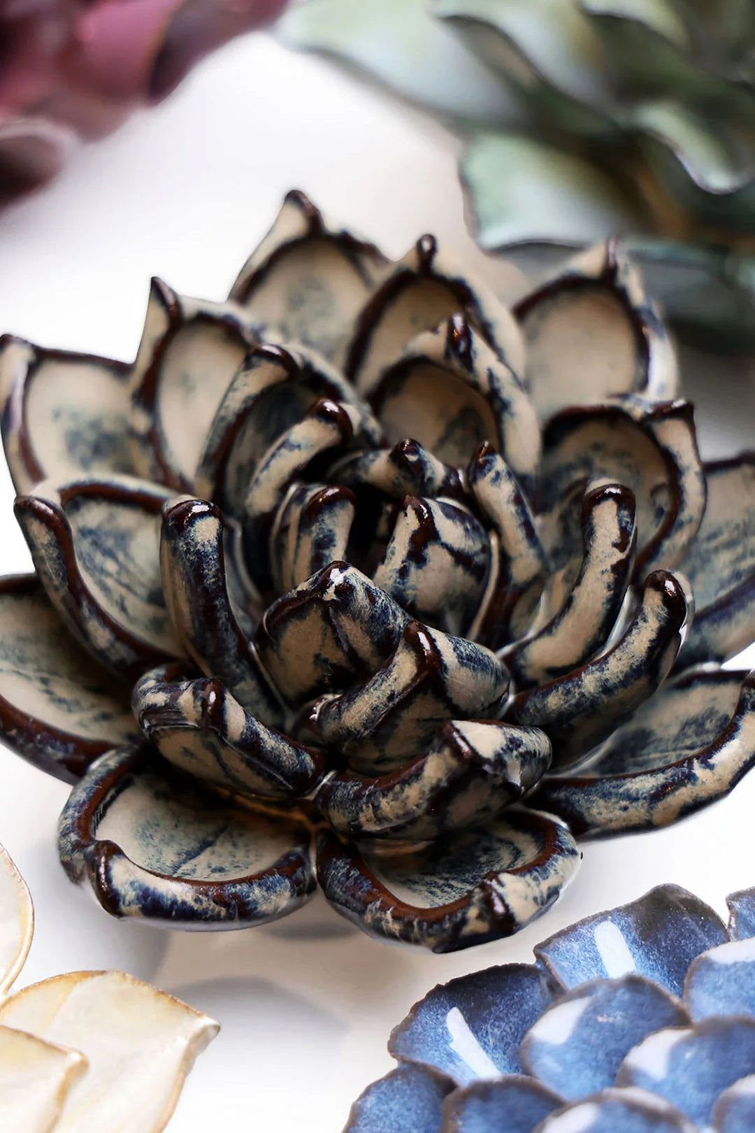 Latte Echeveria ceramic wall flower styled on a white table with other flowers — Chive Studio