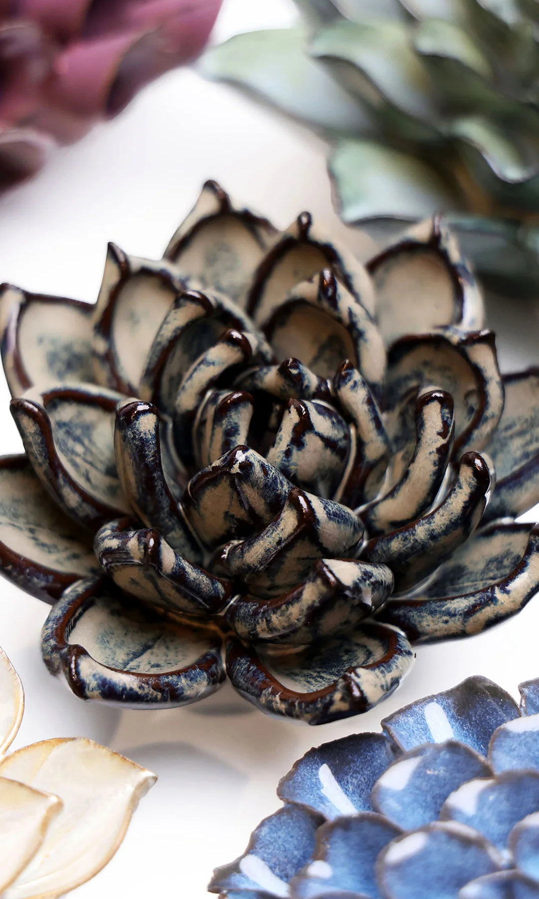 Latte Echeveria ceramic wall flower styled on a white table with other flowers — Chive Studio
