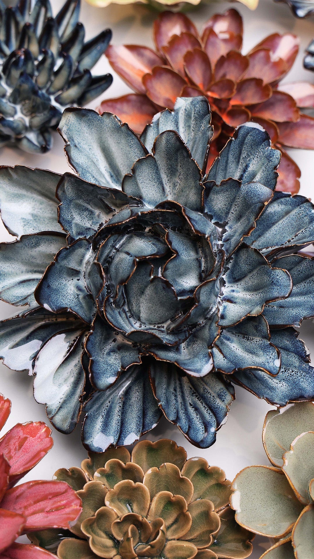 Navy Blue Sorbet Peony ceramic wall flower styled on a white table with other flowers — Chive Studio