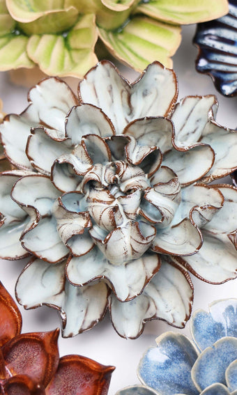 Chocolate Mint Lisianthus ceramic wall flower styled on a white table with other flowers — Chive Studio