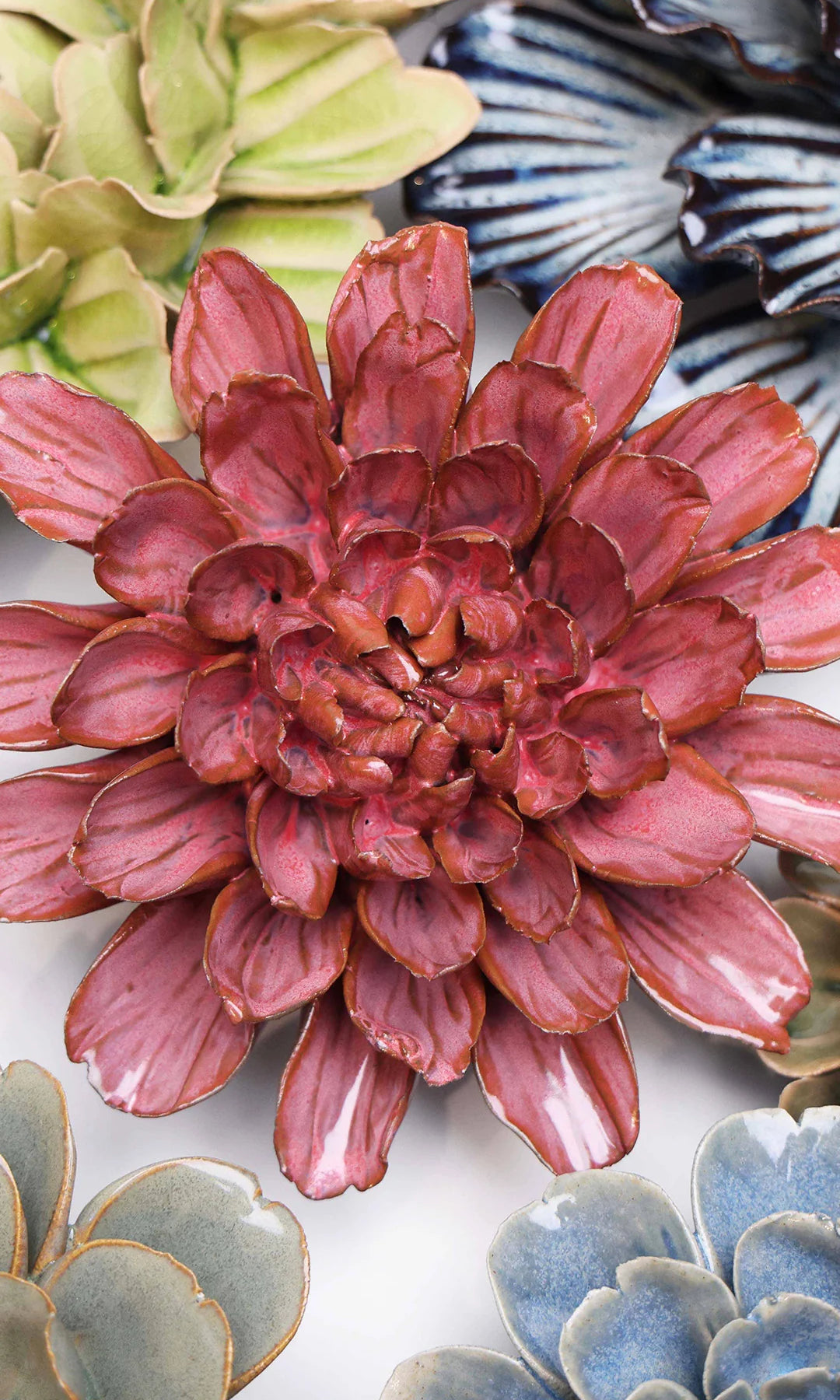 Blush Pink Star Dahlia ceramic wall flower styled on a white table with other flowers — Chive Studio