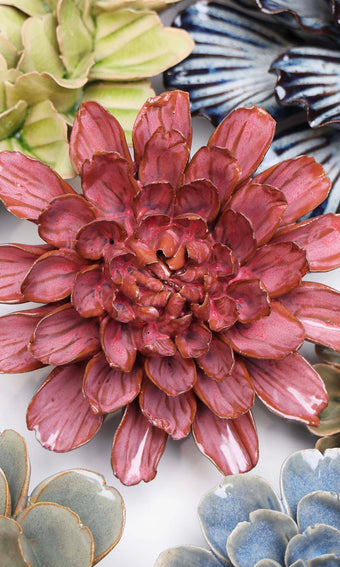 Blush Pink Star Dahlia ceramic wall flower styled on a white table with other flowers — Chive Studio