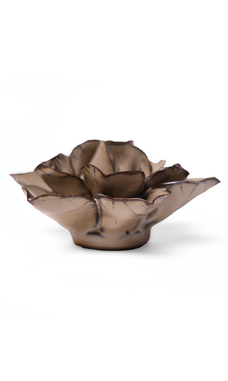 A metallic bronze flower-shaped bowl with a textured, petal-like design, photographed on a clean white background.