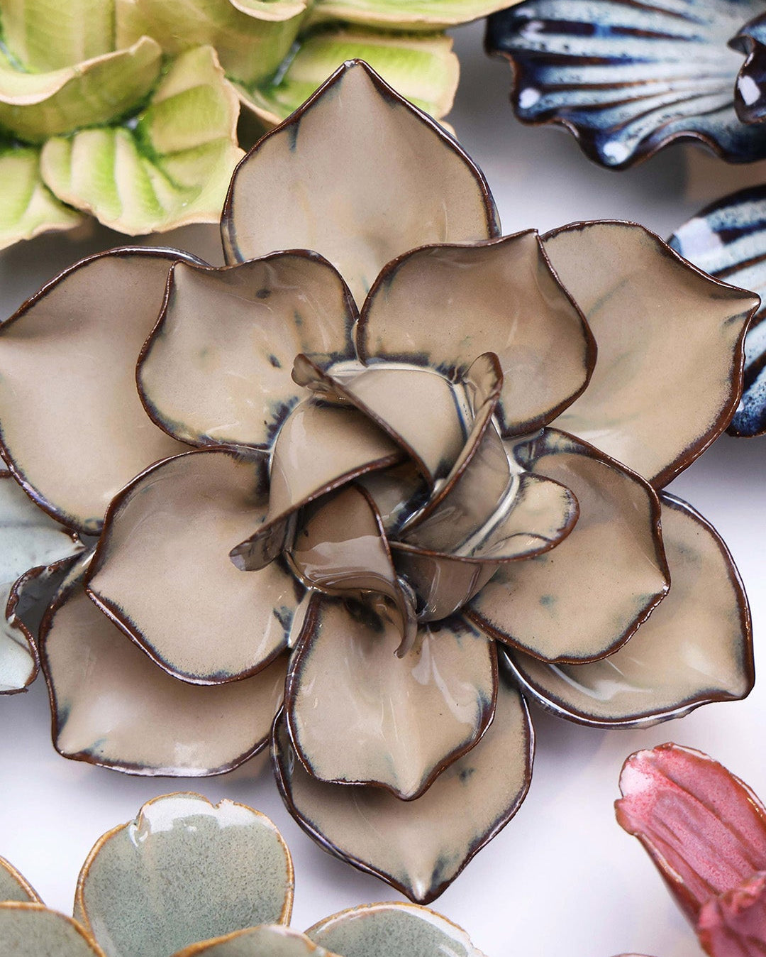 Latte Daffodil ceramic wall flower styled on a white table with other flowers — Chive Studio