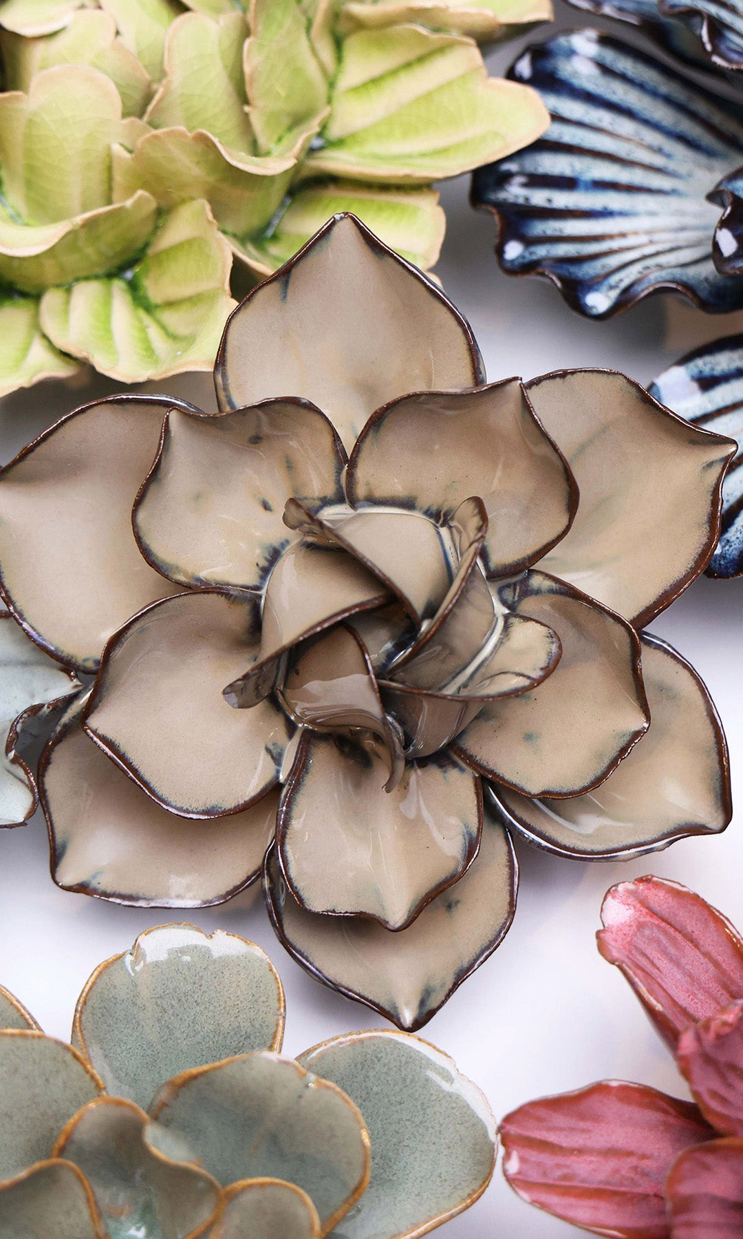 Latte Daffodil ceramic wall flower styled on a white table with other flowers — Chive Studio