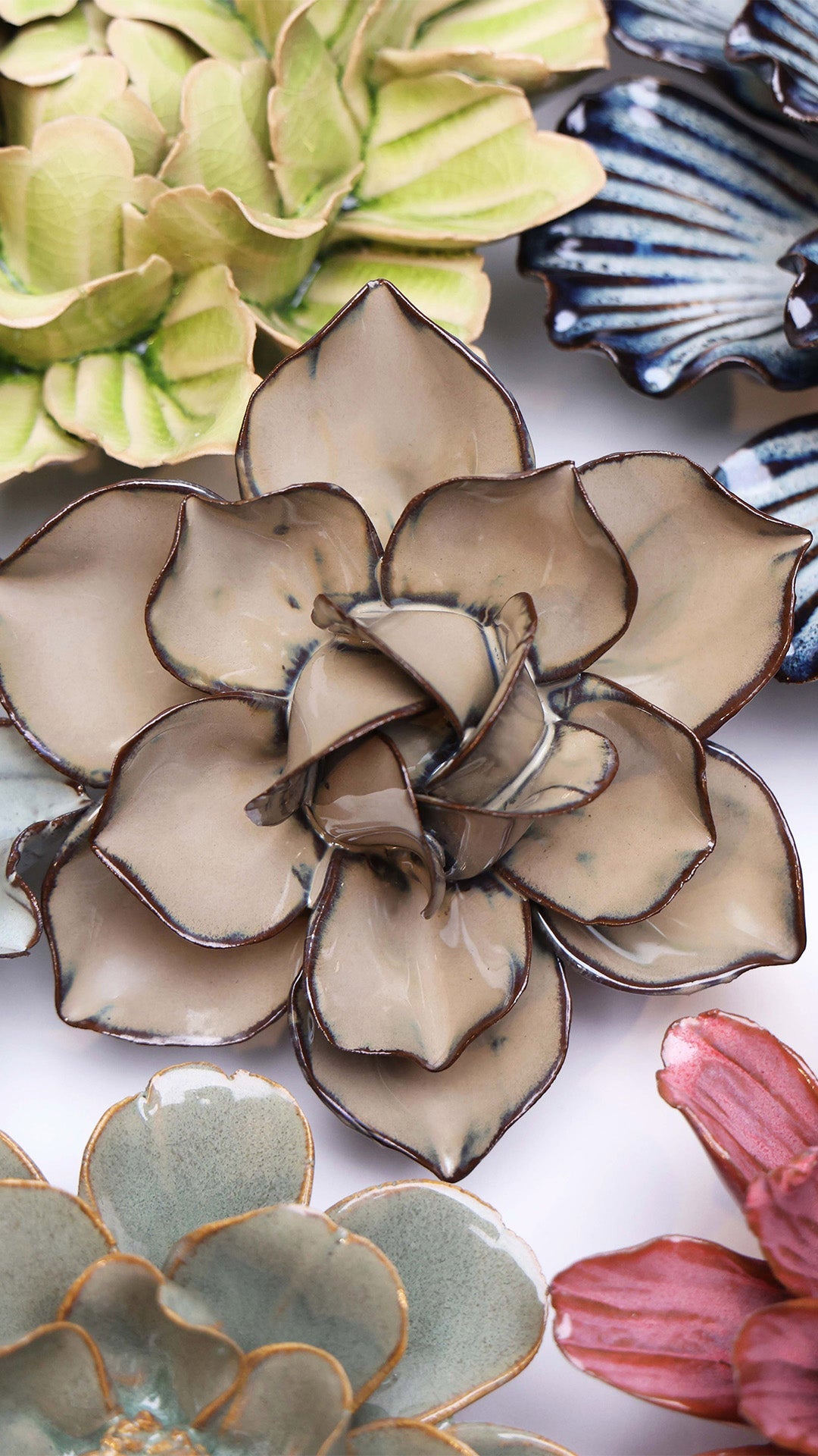 Latte Daffodil ceramic wall flower styled on a white table with other flowers — Chive Studio