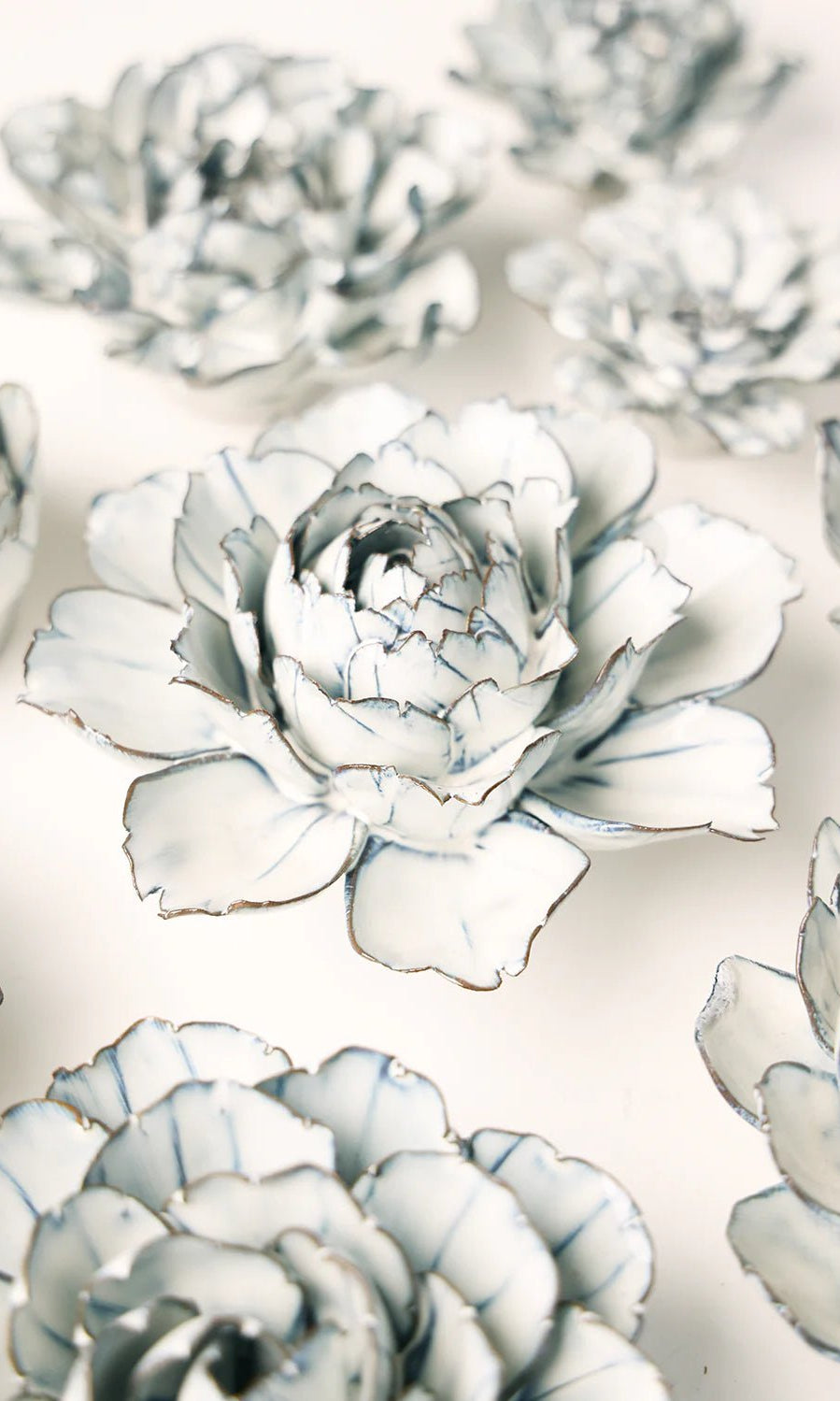 Blue White Keiko Peony ceramic wall flower styled on wall — Coastal Collection — Chive Studio Toronto
