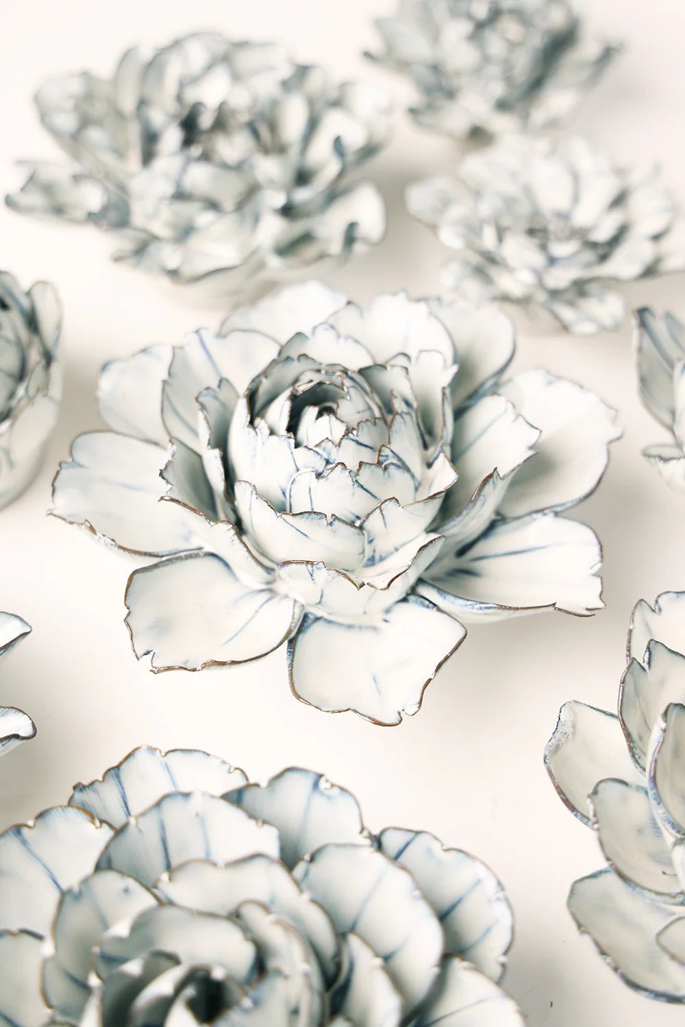 Blue White Keiko Peony ceramic wall flower styled on wall — Coastal Collection — Chive Studio Toronto