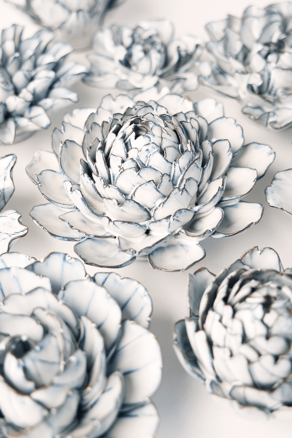 Blue White Hermione Peony ceramic wall flower styled on wall — Coastal Collection — Chive Studio Toronto