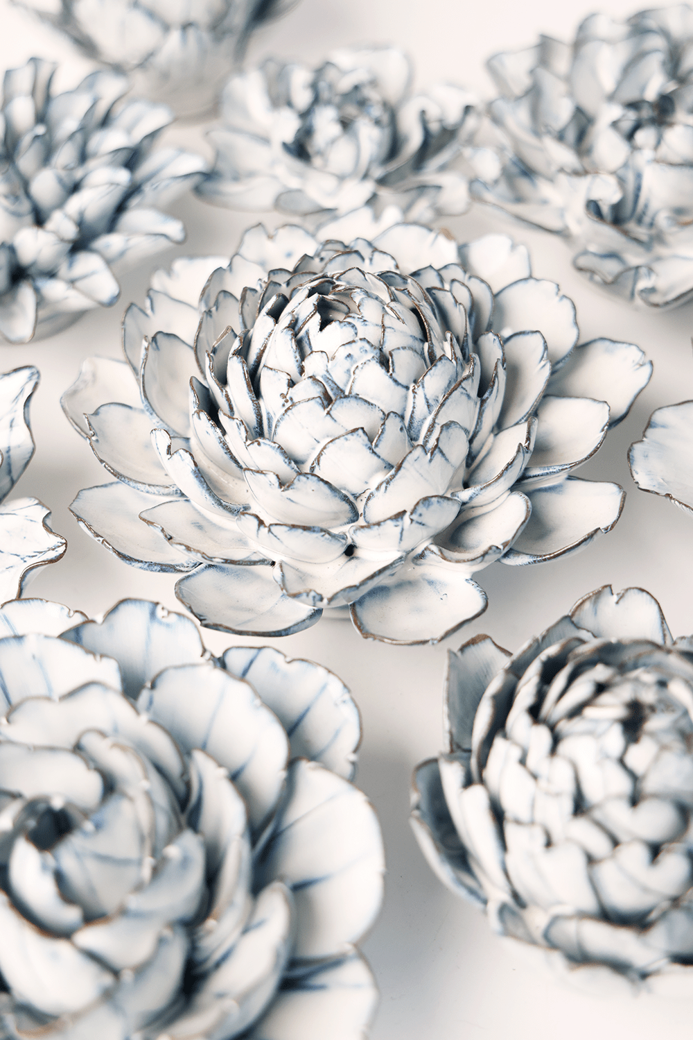 Blue White Hermione Peony ceramic wall flower styled on wall — Coastal Collection — Chive Studio Toronto