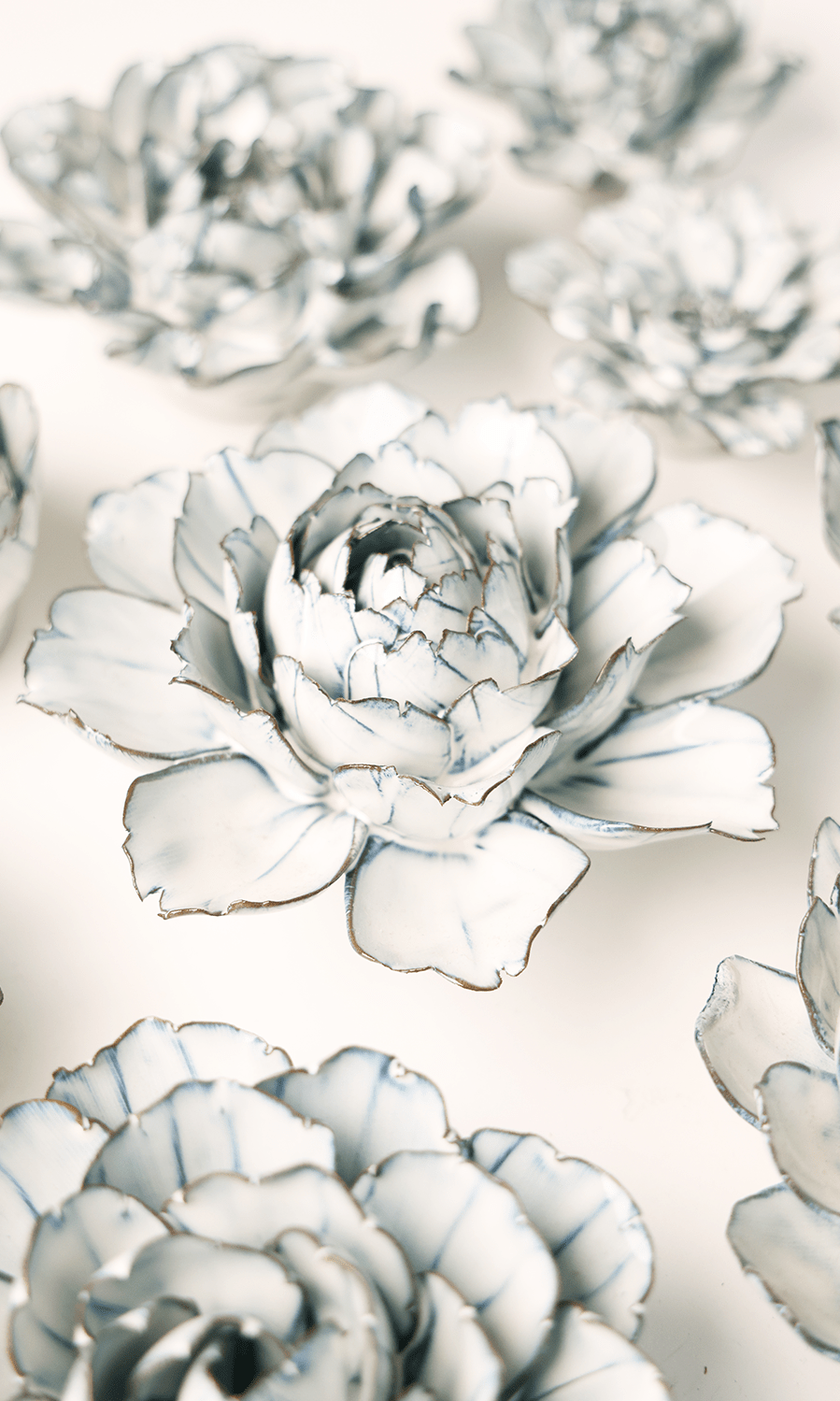 Blue White Camellia ceramic wall flower styled on wall — Coastal Collection — Chive Studio Toronto