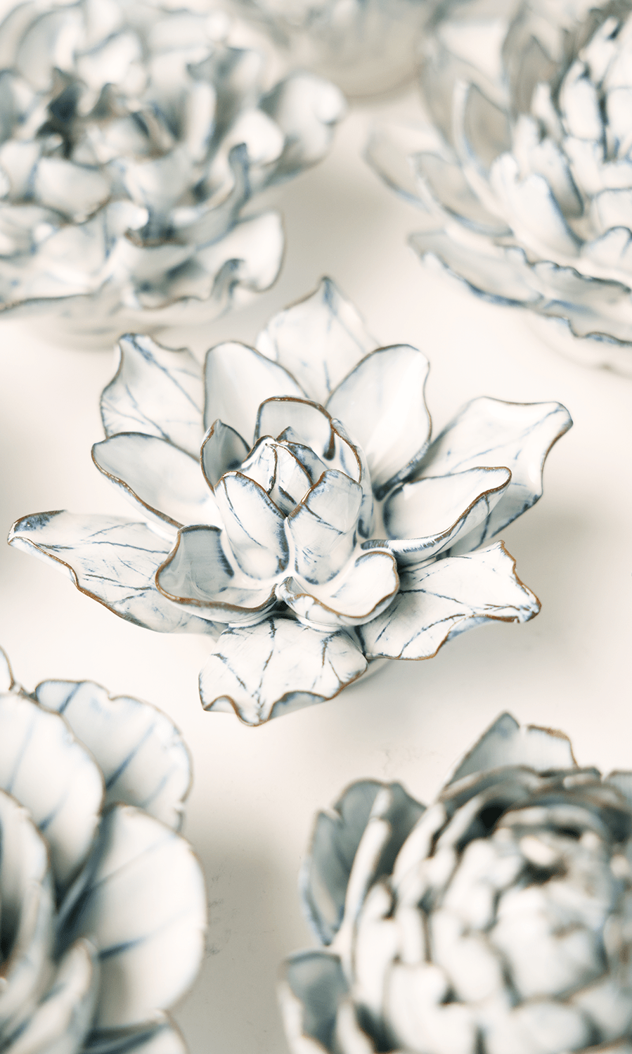 Blue White Columbine ceramic wall flower styled on wall — Coastal Collection — Chive Studio Toronto