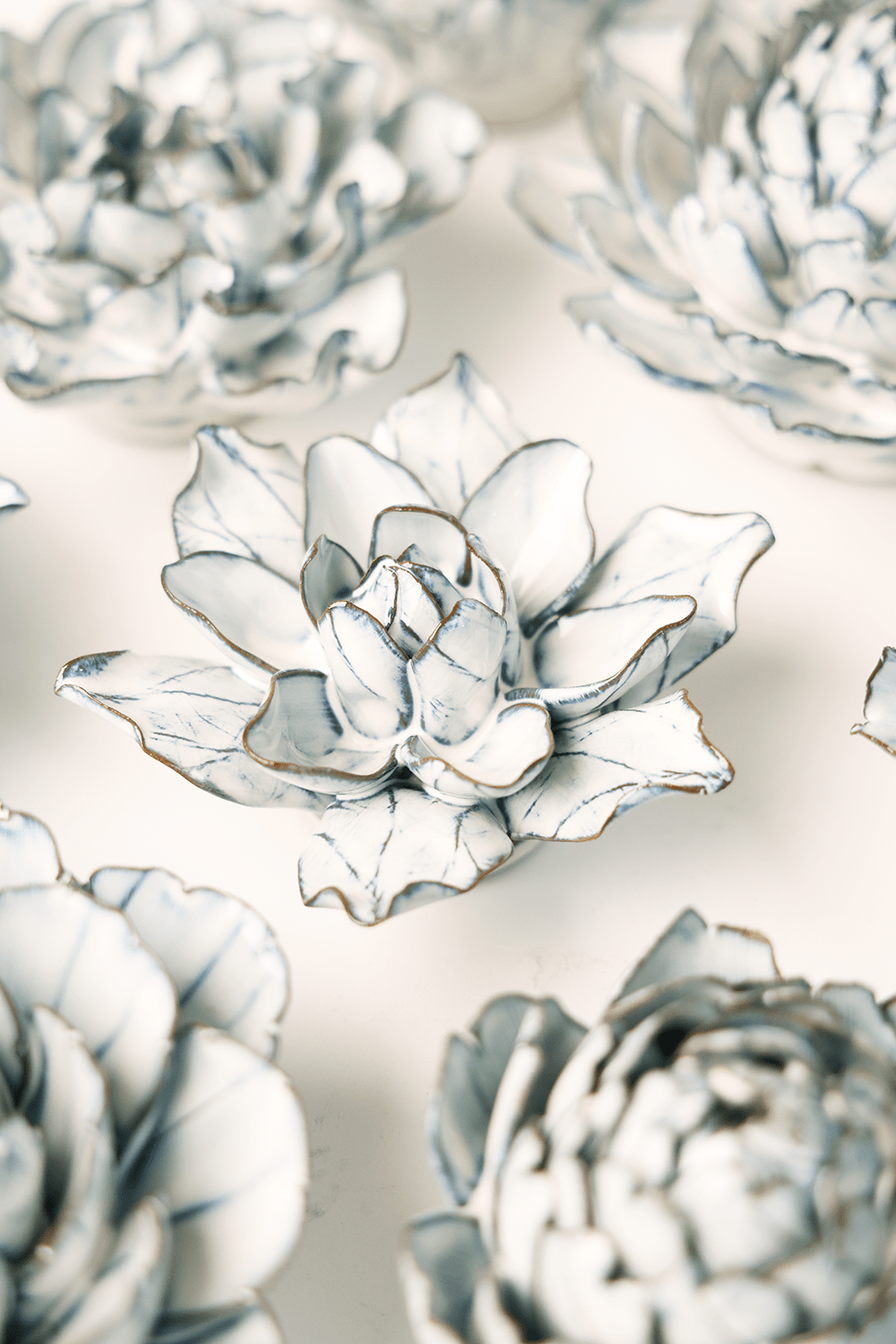 Blue White Columbine ceramic wall flower styled on wall — Coastal Collection — Chive Studio Toronto