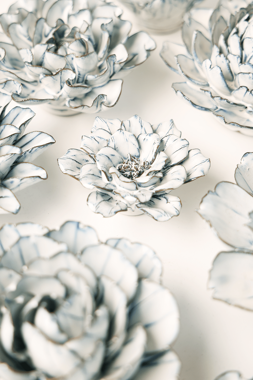Blue White Cosmos ceramic wall flower styled on wall — Coastal Collection — Chive Studio Toronto