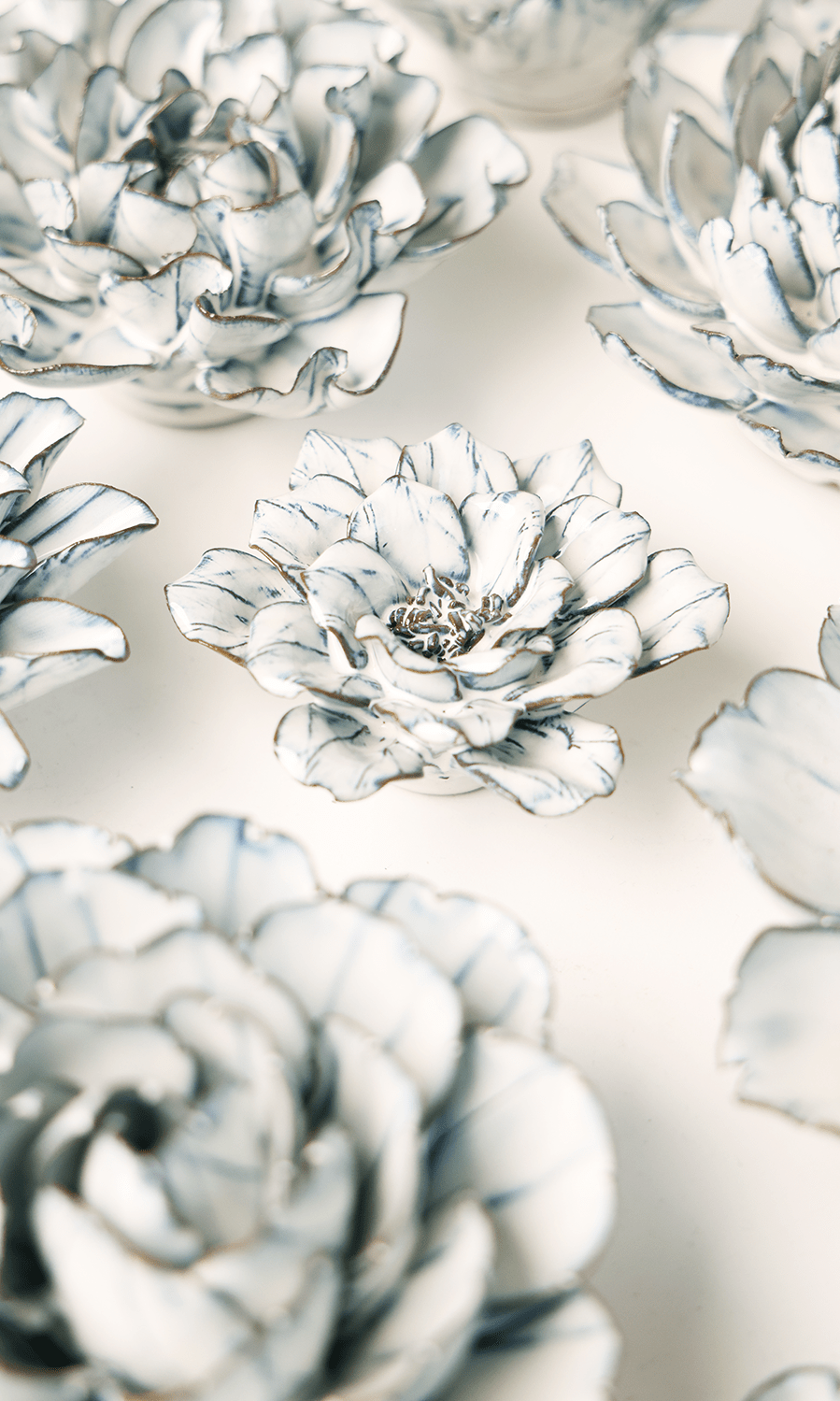 Blue White Cosmos ceramic wall flower styled on wall — Coastal Collection — Chive Studio Toronto
