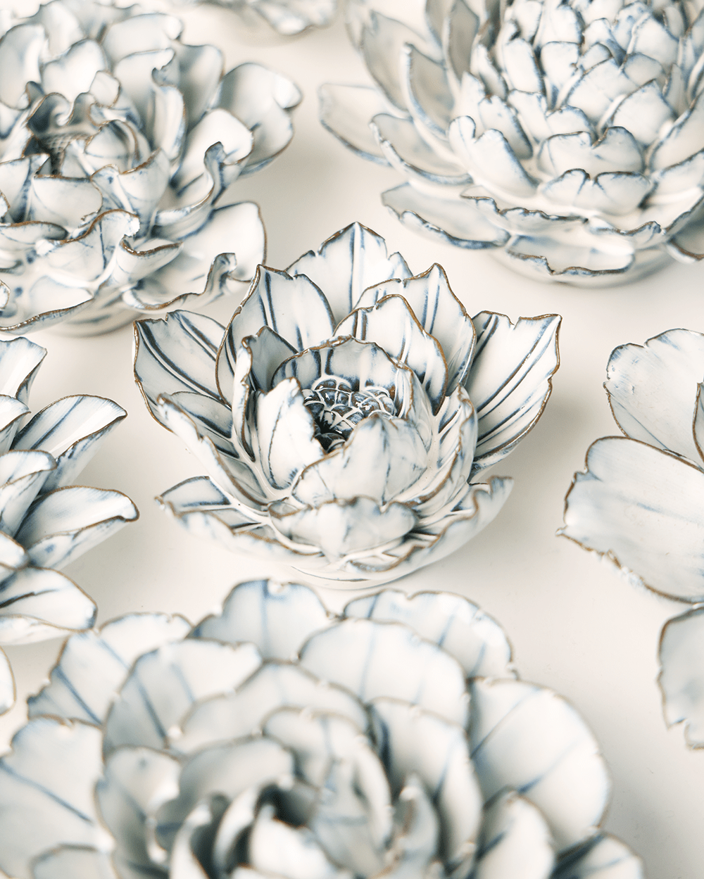 Blue White Purslane ceramic wall flower styled on wall — Coastal Collection — Chive Studio Toronto