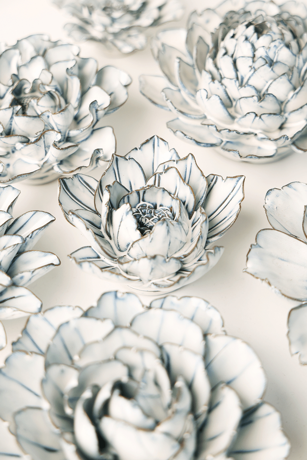 Blue White Purslane ceramic wall flower styled on wall — Coastal Collection — Chive Studio Toronto