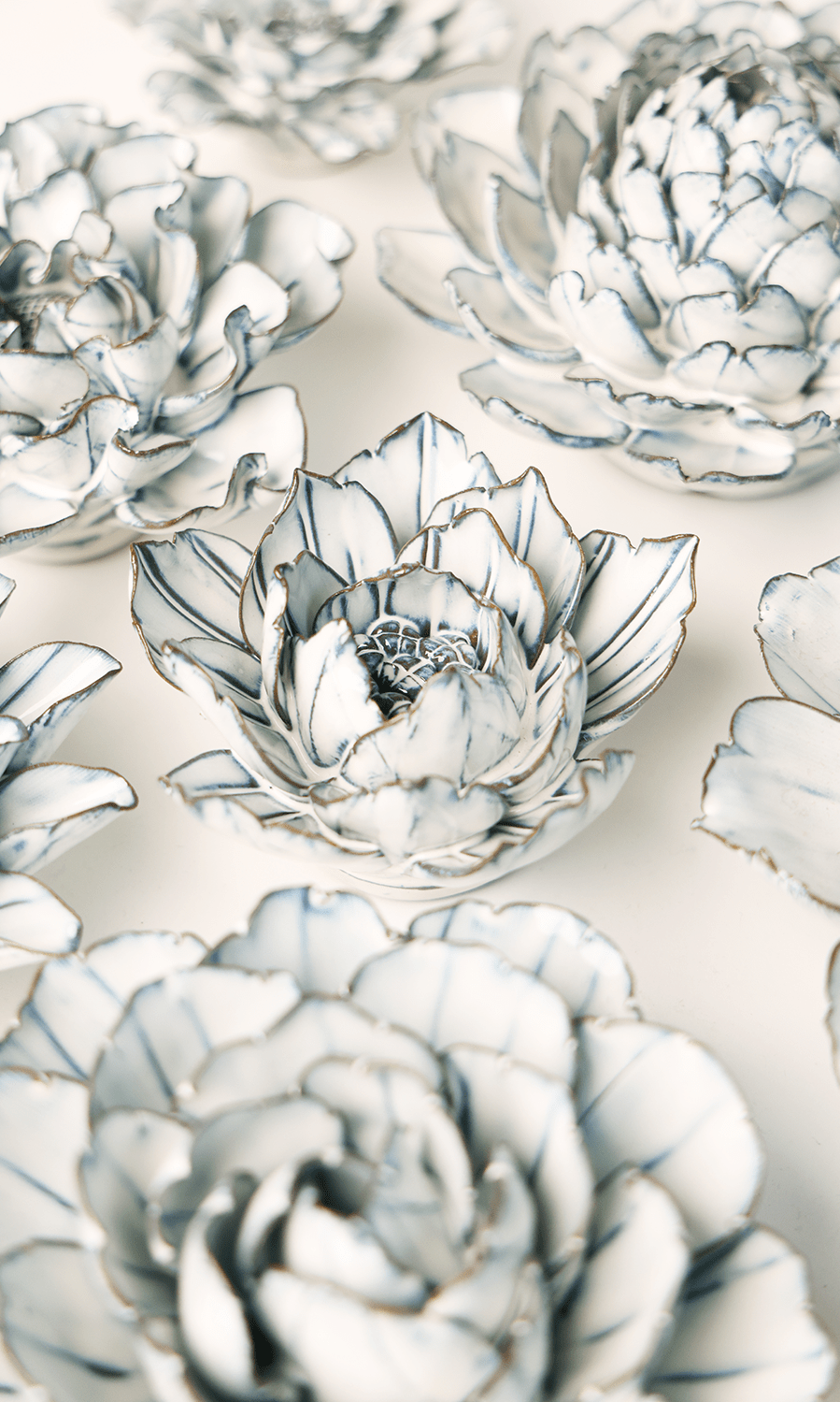 Blue White Purslane ceramic wall flower styled on wall — Coastal Collection — Chive Studio Toronto
