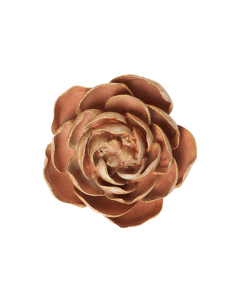 A single artificial rose-shaped flower with layered petals in a warm coppery brown color, isolated on a solid white background.