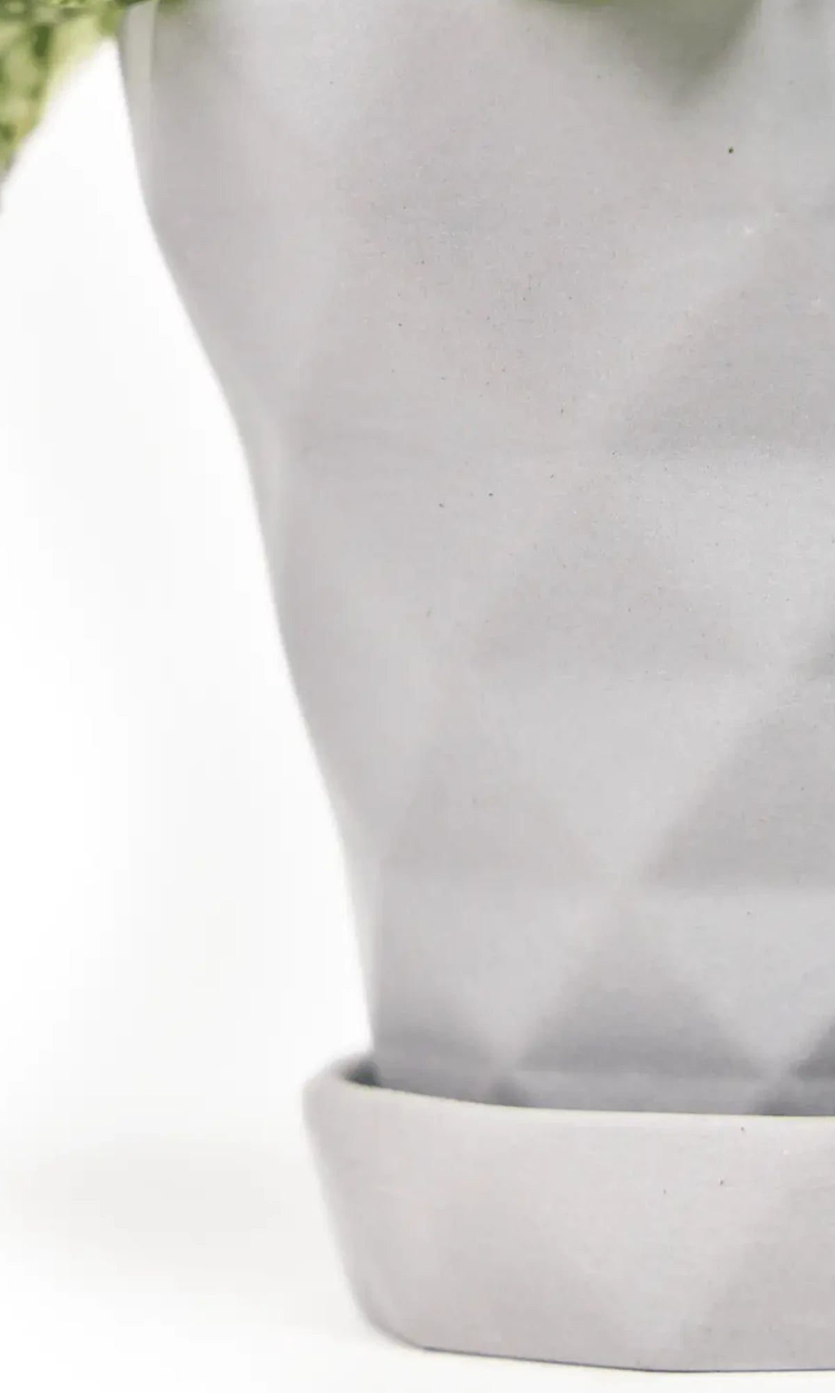 Close up of Chive Diamond medium light grey porcelain pot with drainage and detachable saucer, showing the texture finish.
