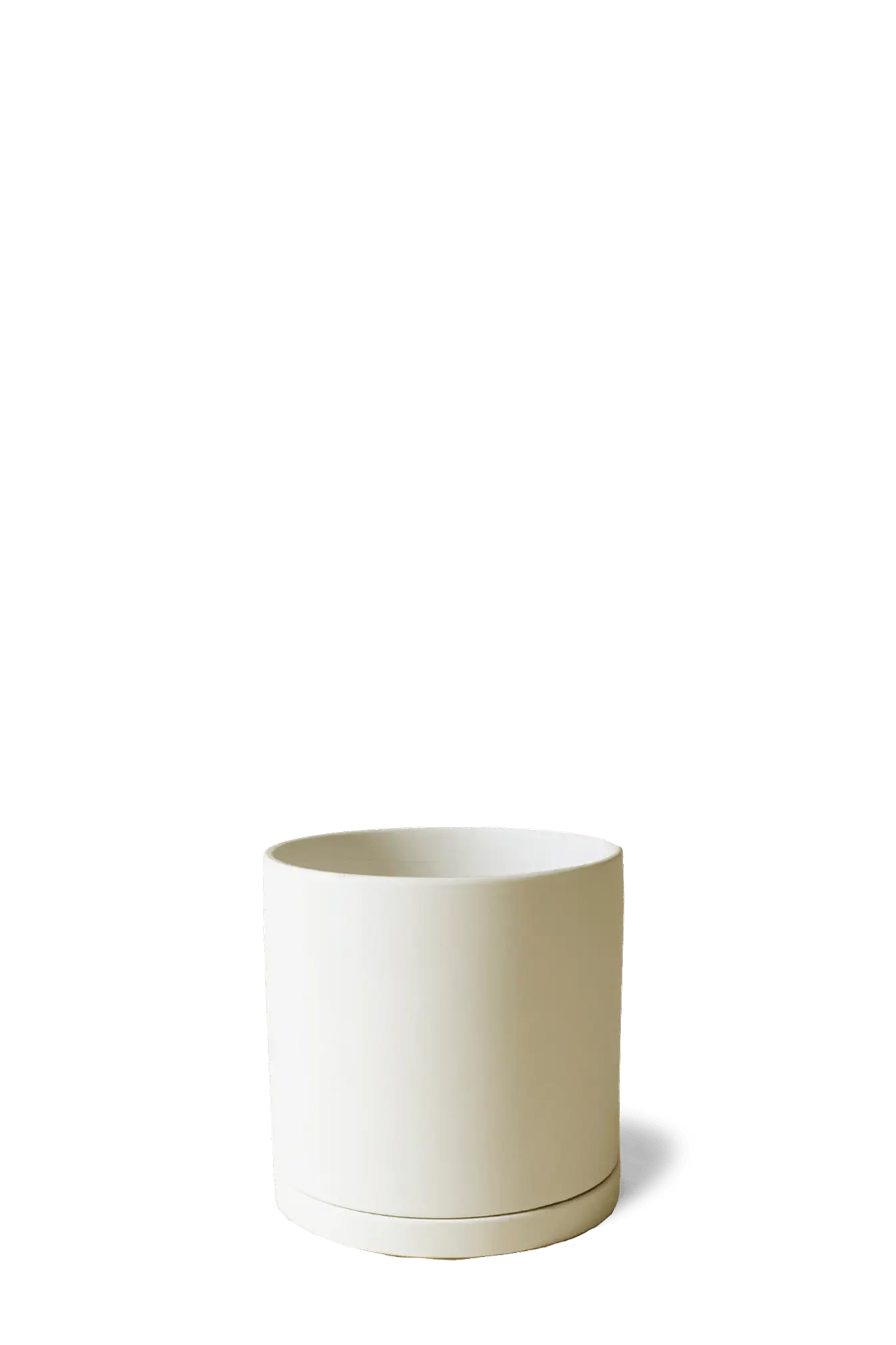 Chive Dojo ceramic planter in warm sandstone with a smooth matte finish and matching saucer.