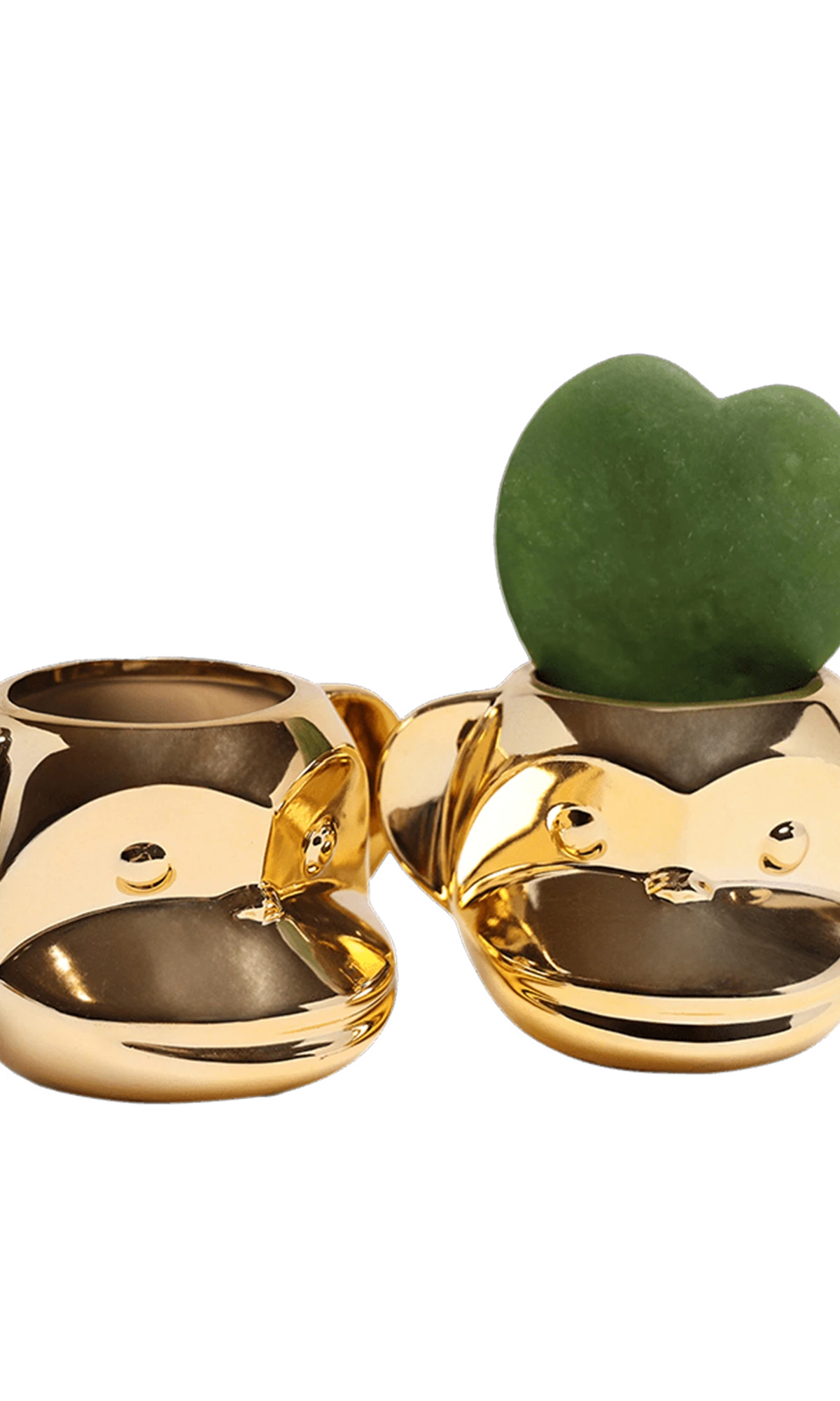 Two Chive Funky Monkey Gold color glazed ceramic monkey shaped planters styled with a small plant.