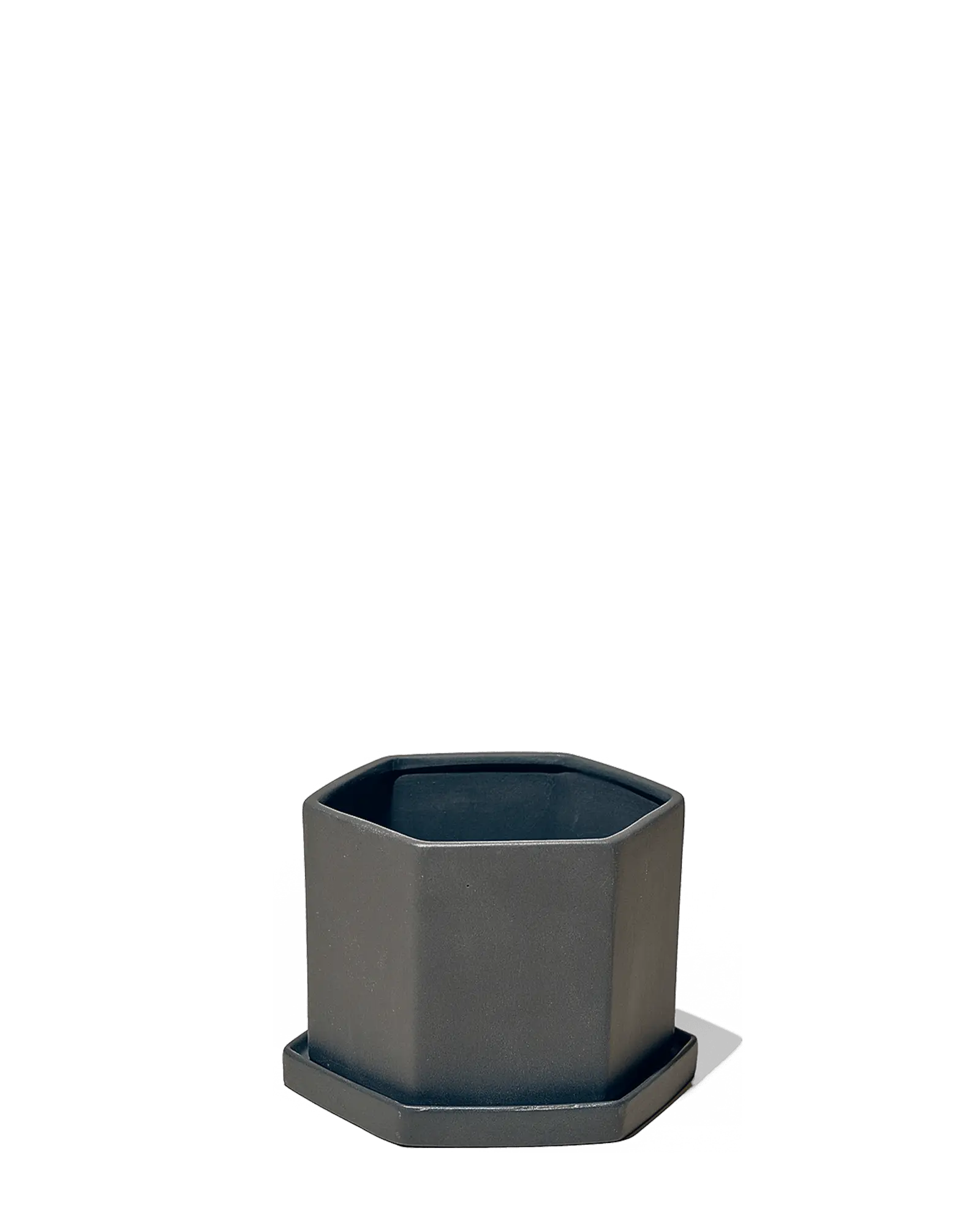 Chive Hexi black matte ceramic medium hexagonal planter with matching saucer.