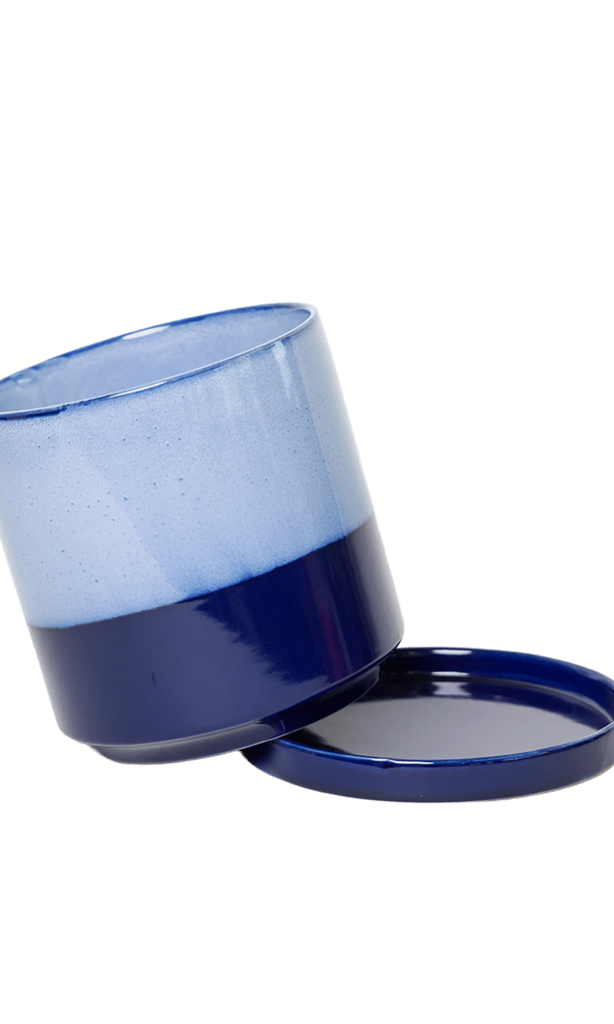 Close-up of the detachable saucer and drainage on a Chive Minute small cobalt blue ceramic pot.