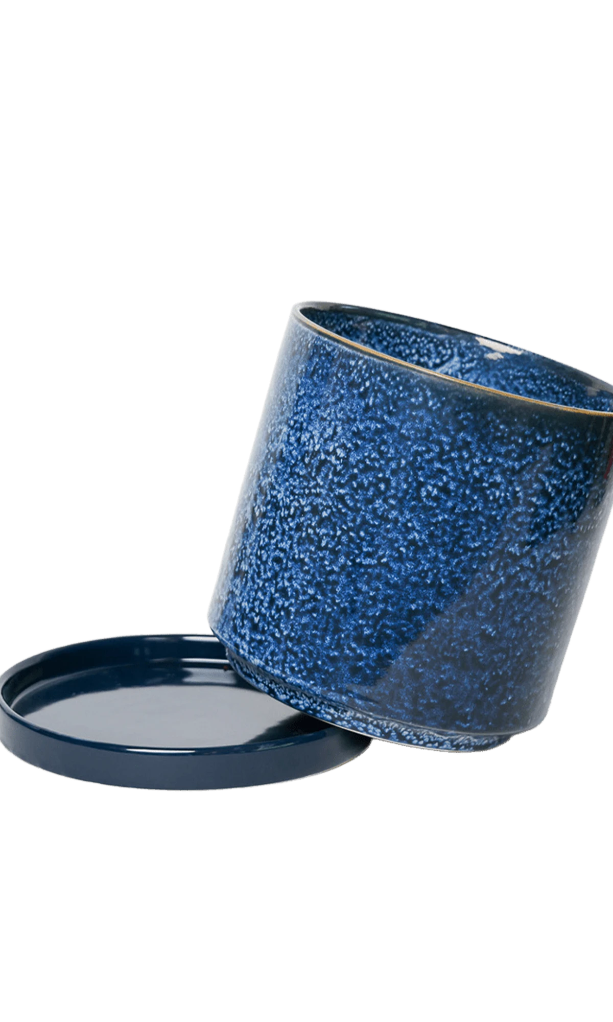 Close-up of the detachable saucer and drainage hole on a Chive Minute small cosmos ceramic pot.