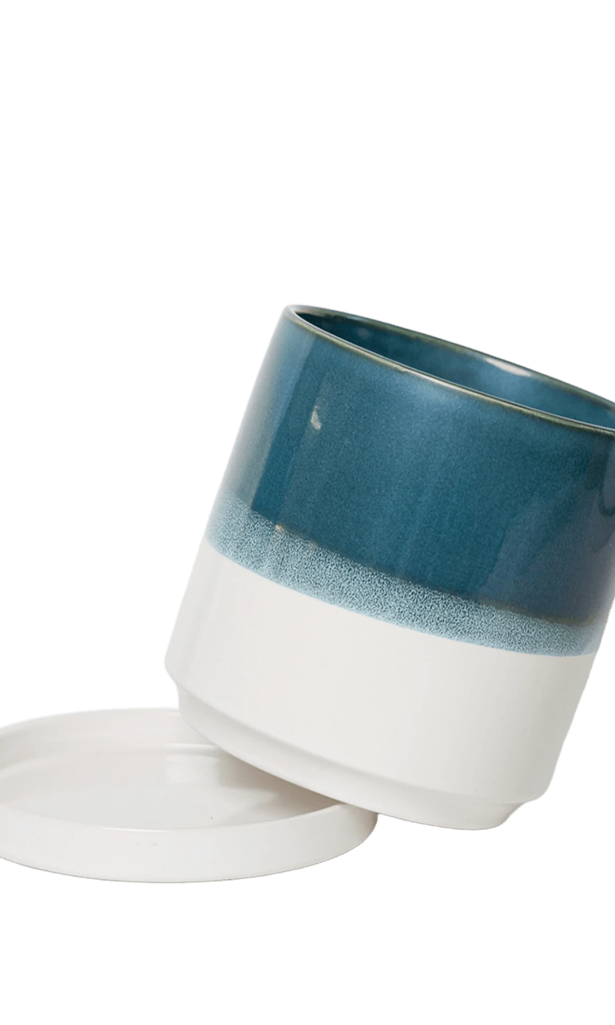 Chive Minute small green-blue ceramic pot with drainage tilted to show the detachable saucer.