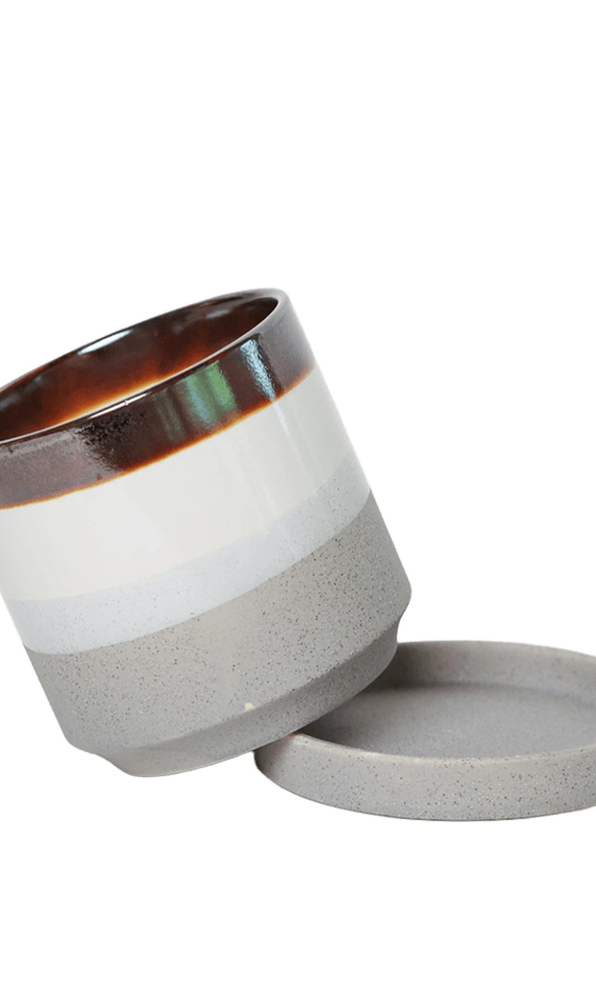 Chive Minute small mocha cement ceramic pot with drainage tilted to show the detachable saucer.