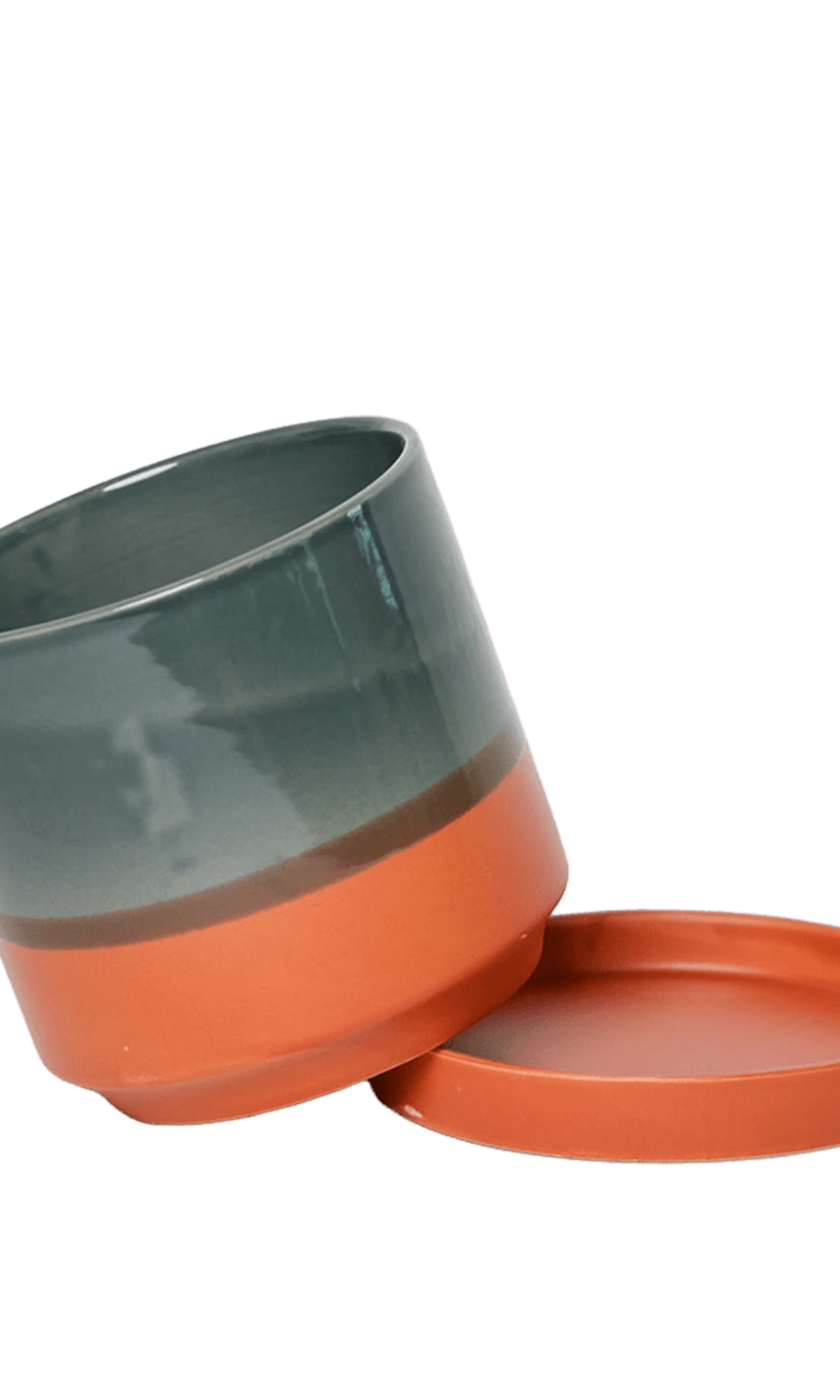 Chive Minute small terracotta ceramic pot with drainage tilted to show the detachable saucer.