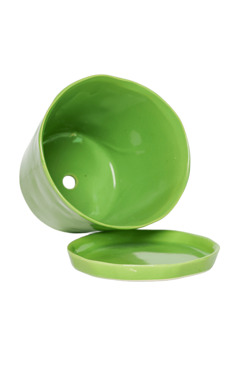 Close-up of the detachable saucer and drainage hole on a Chive Tika greenery ceramic large pot.