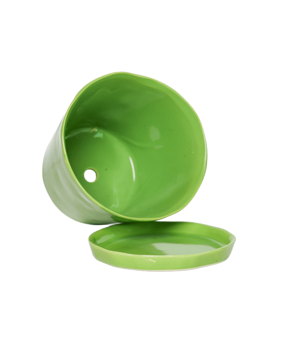 Close-up of the detachable saucer and drainage hole on a Chive Tika greenery ceramic large pot.