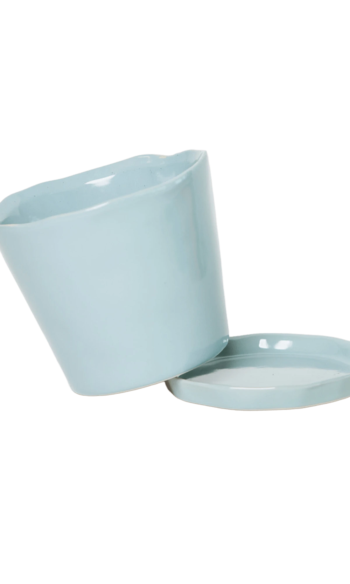 Close-up of the detachable saucer and drainage hole on a Chive Tika new grey ceramic medium pot.