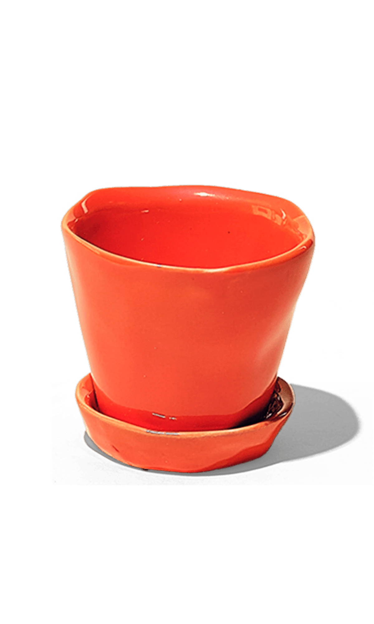 Chive Tika orange ceramic small plant pot with drainage hole and detachable saucer.