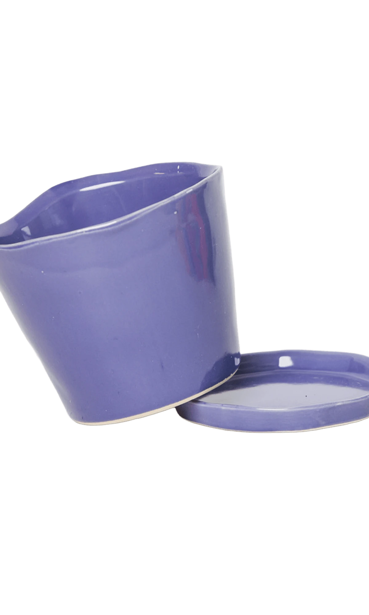 Close-up of the detachable saucer and drainage hole on a Chive Tika ultra violet ceramic medium pot.