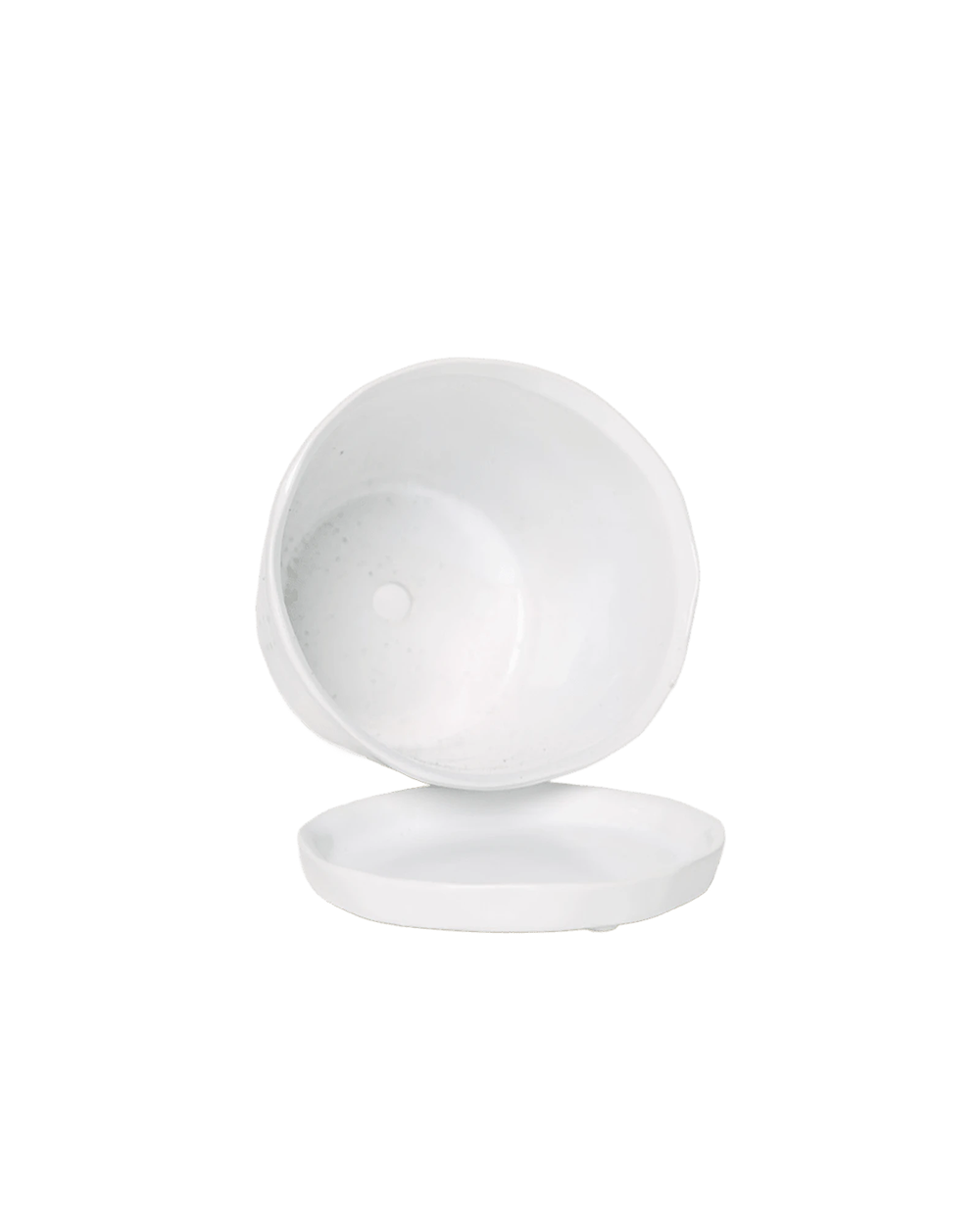 Close-up of the detachable saucer and drainage hole on a Chive Tika white ceramic large pot.