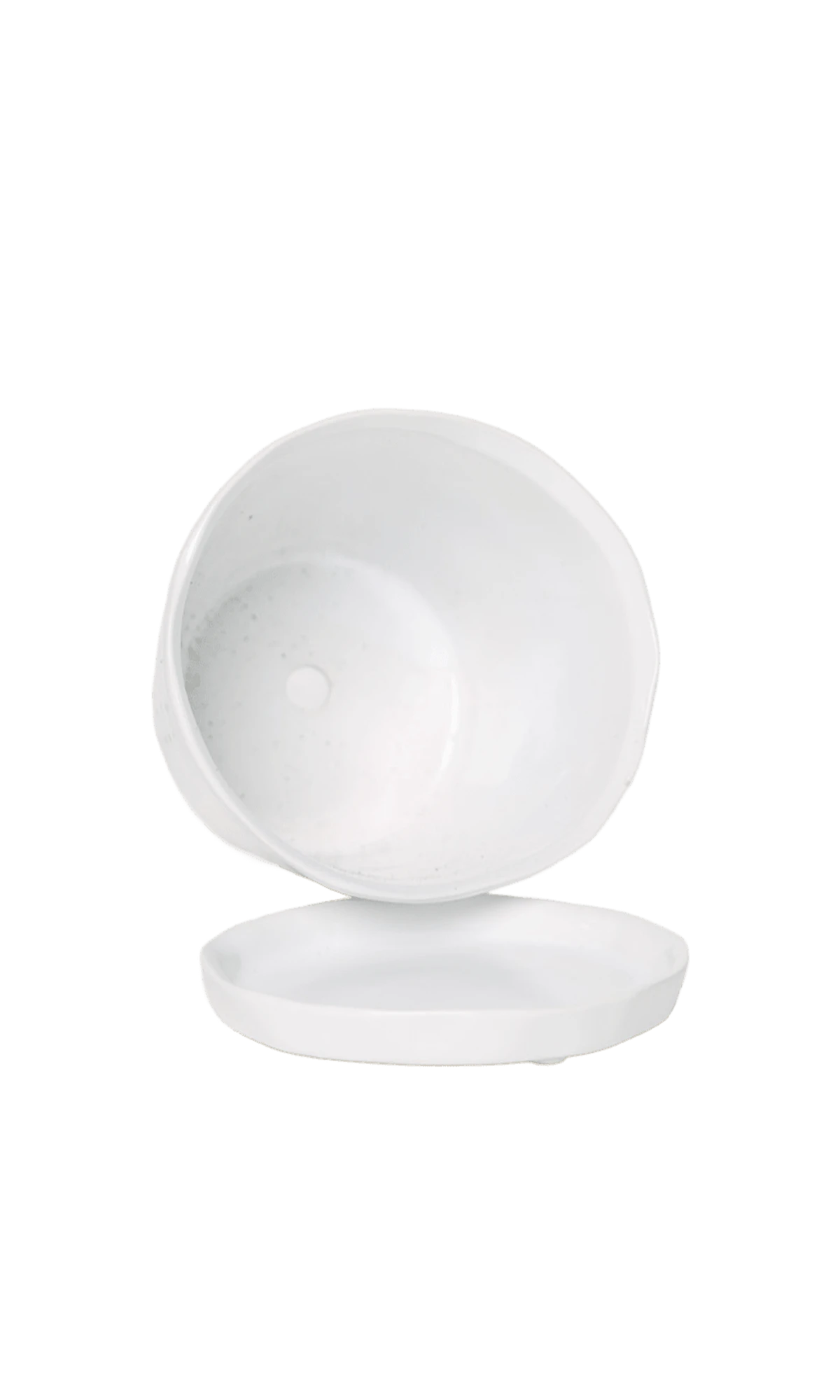Close-up of the detachable saucer and drainage hole on a Chive Tika white ceramic large pot.