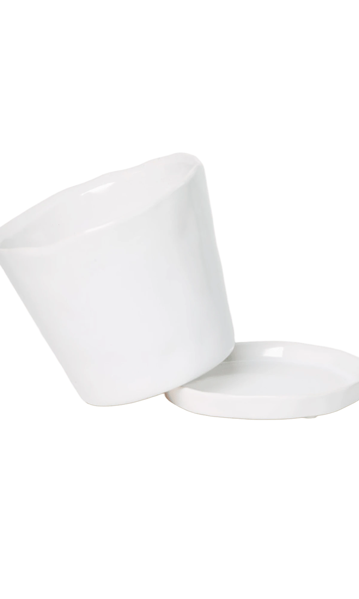 Close-up of the detachable saucer and drainage hole on a Chive Tika white ceramic medium pot.